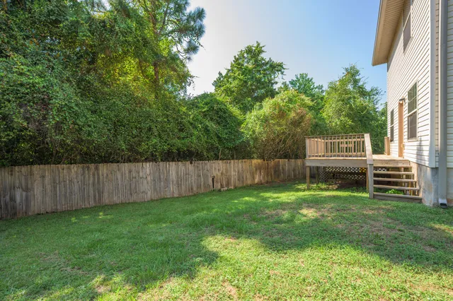 a view of a backyard with a small cabin