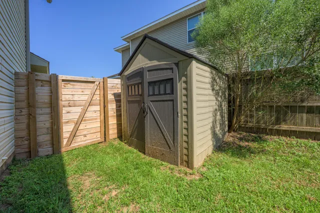 a view of house with backyard and garden
