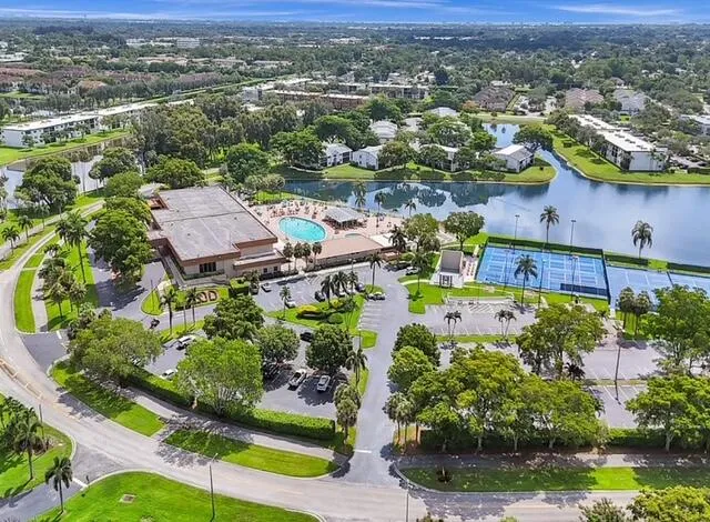 an aerial view of residential house with outdoor space and swimming pool