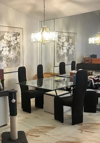 a dining room with furniture and window