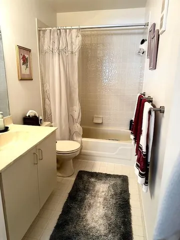 a bathroom with a bathtub sink and toilet