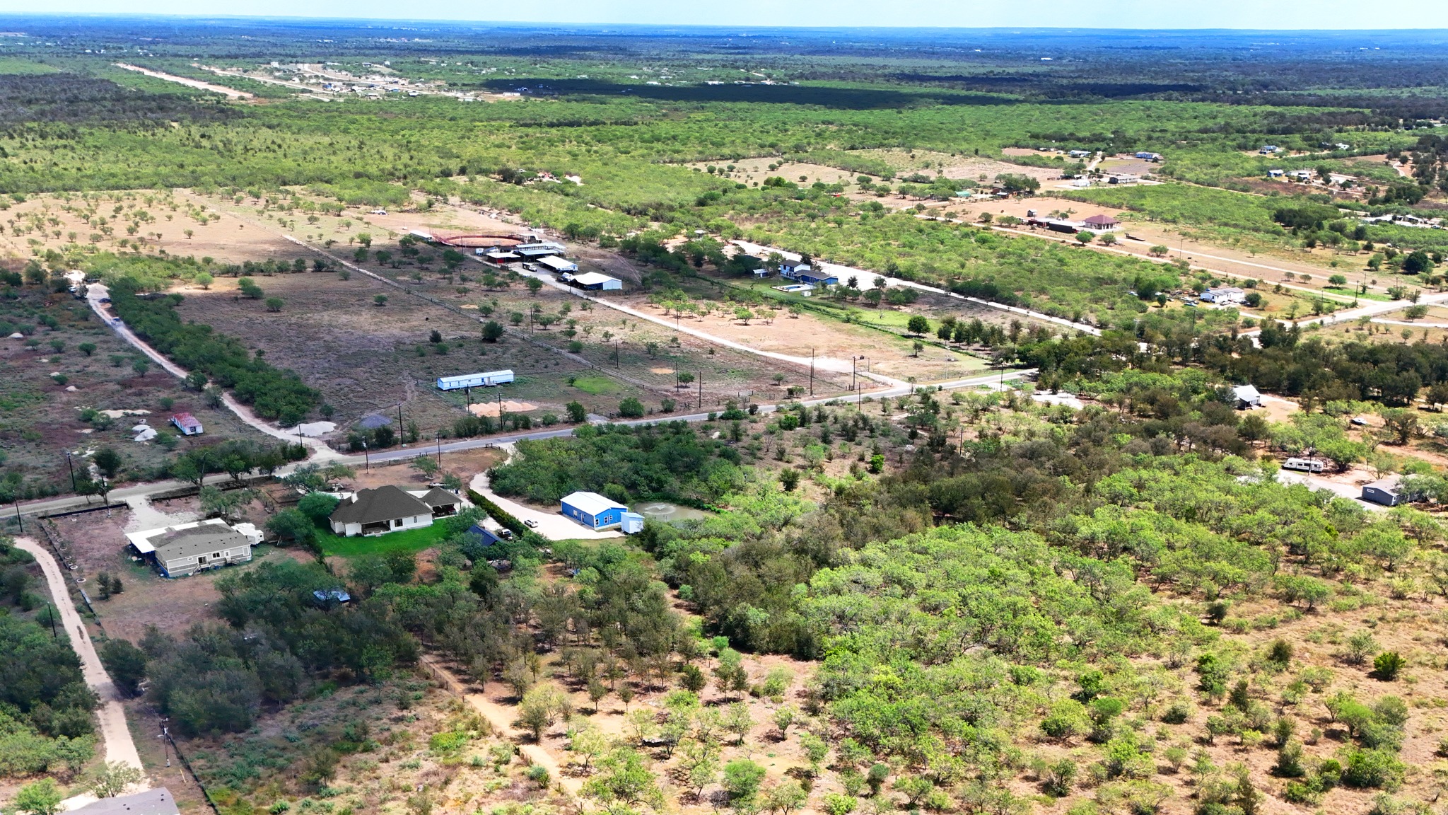 4001 Barth Road Lockhart, TX 78644 - Photo 34 of 38 An aerial perspective captures the vast countryside layout surrounding this expansive rural property.