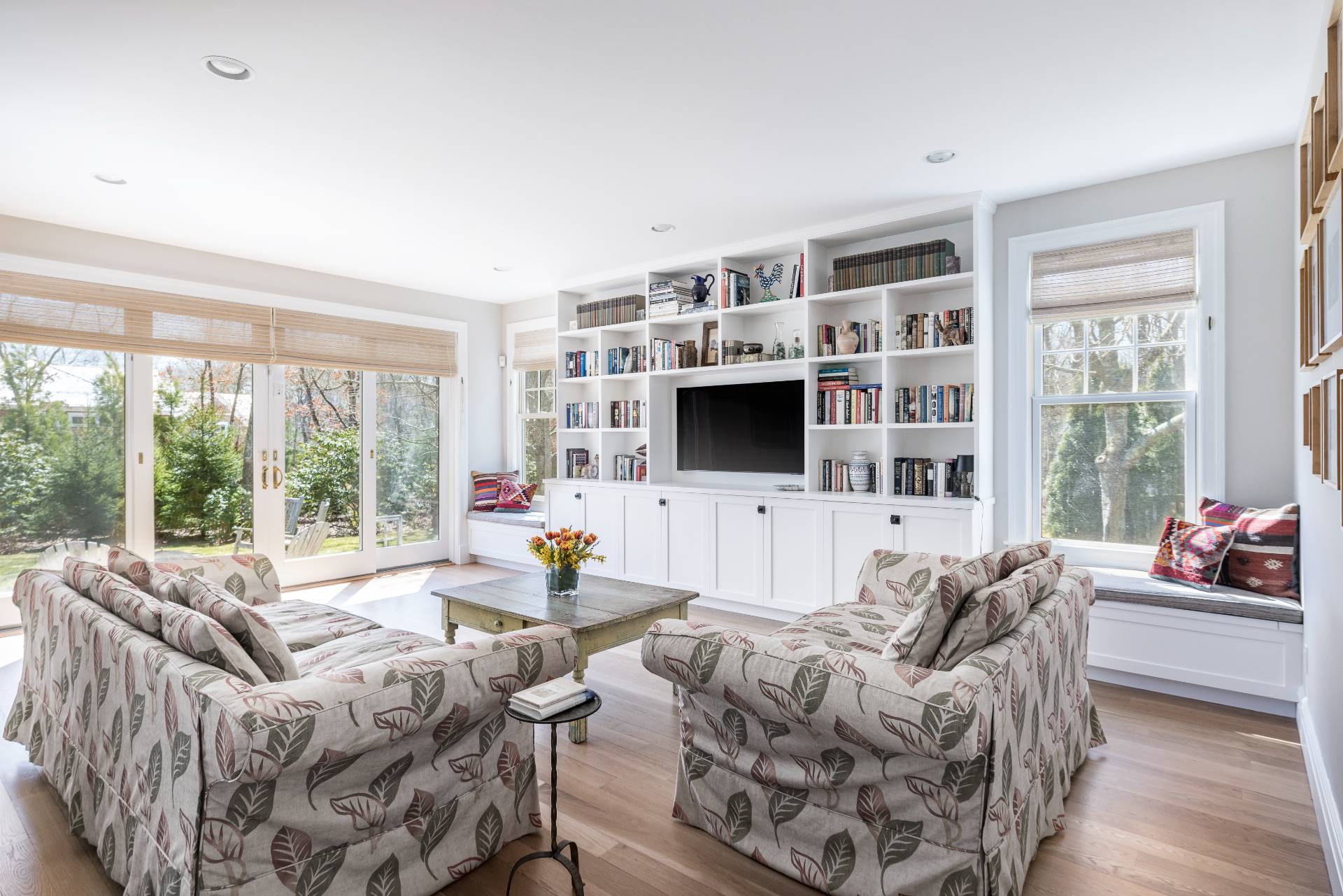 9 Dering Lane East Hampton, NY 11937 - Photo 11 of 30 a living room with furniture a flat screen tv and a floor to ceiling window