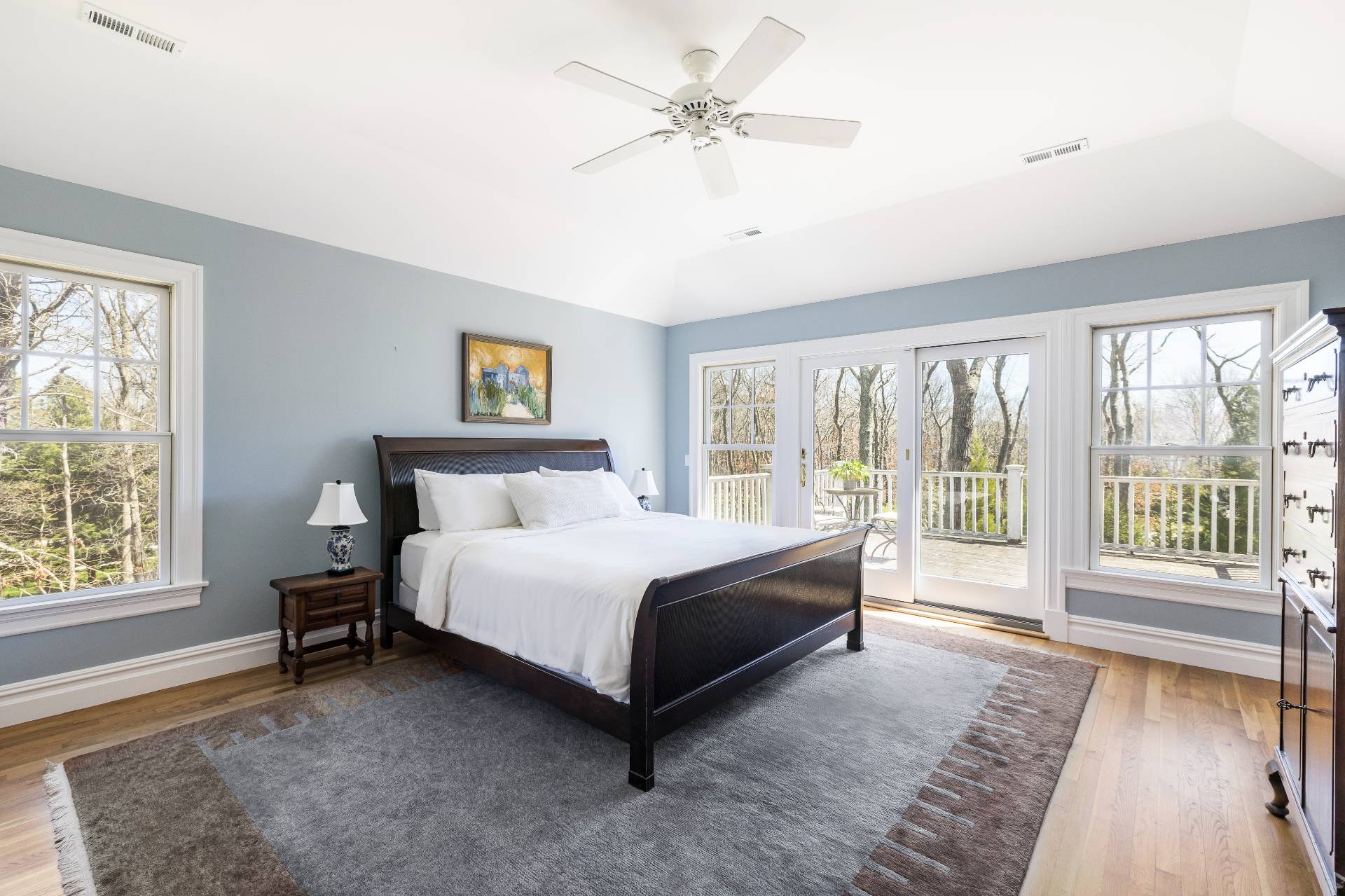 9 Dering Lane East Hampton, NY 11937 - Photo 17 of 30 a spacious bedroom with a large bed and a large window