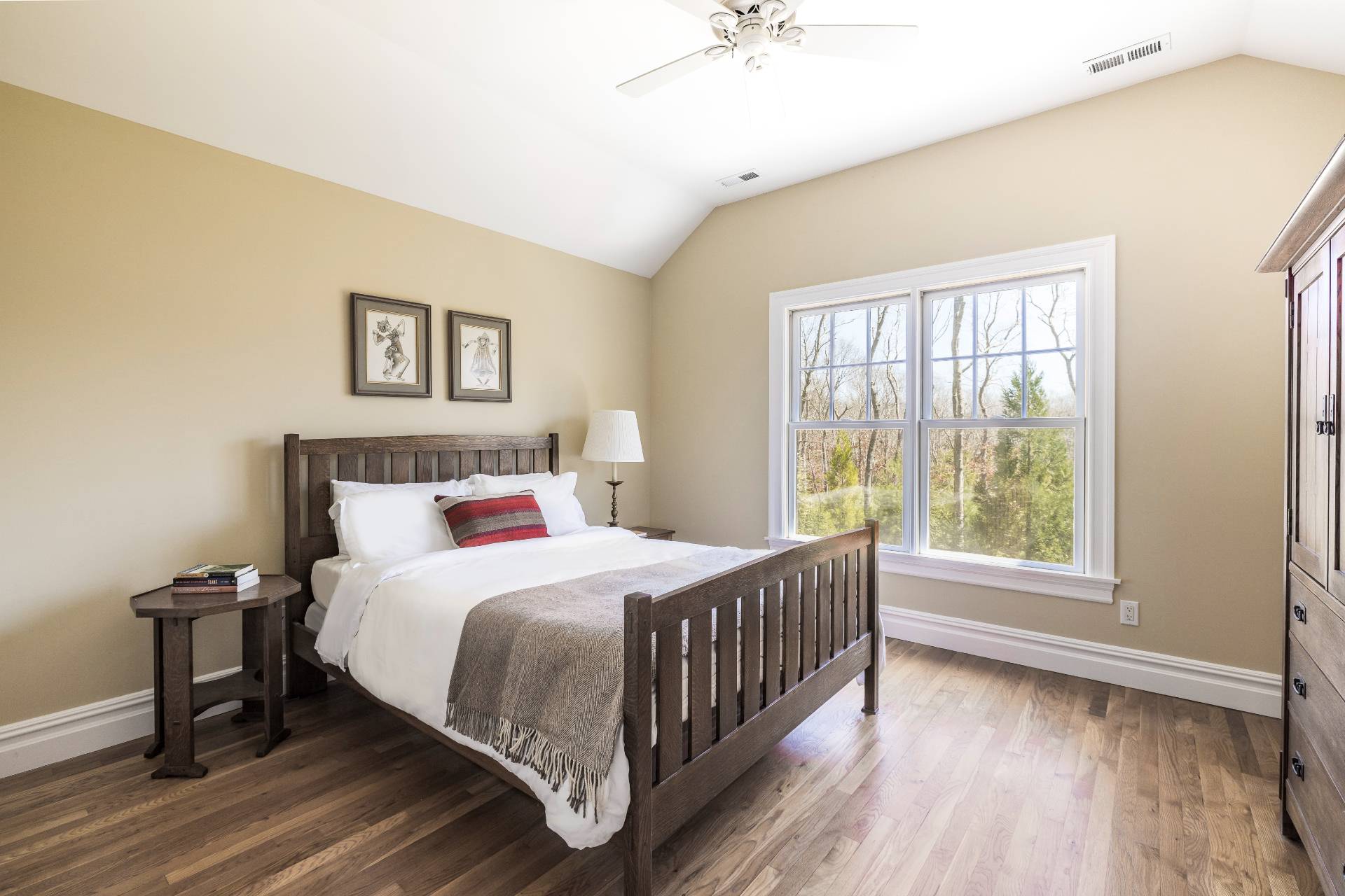 9 Dering Lane East Hampton, NY 11937 - Photo 22 of 30 a bedroom with a bed and a large window