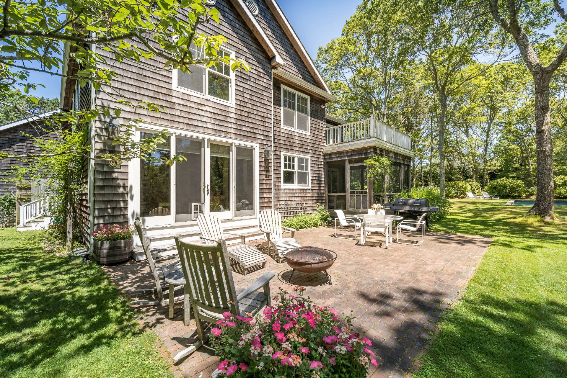 9 Dering Lane East Hampton, NY 11937 - Photo 26 of 30 a view of a house with backyard sitting area and garden