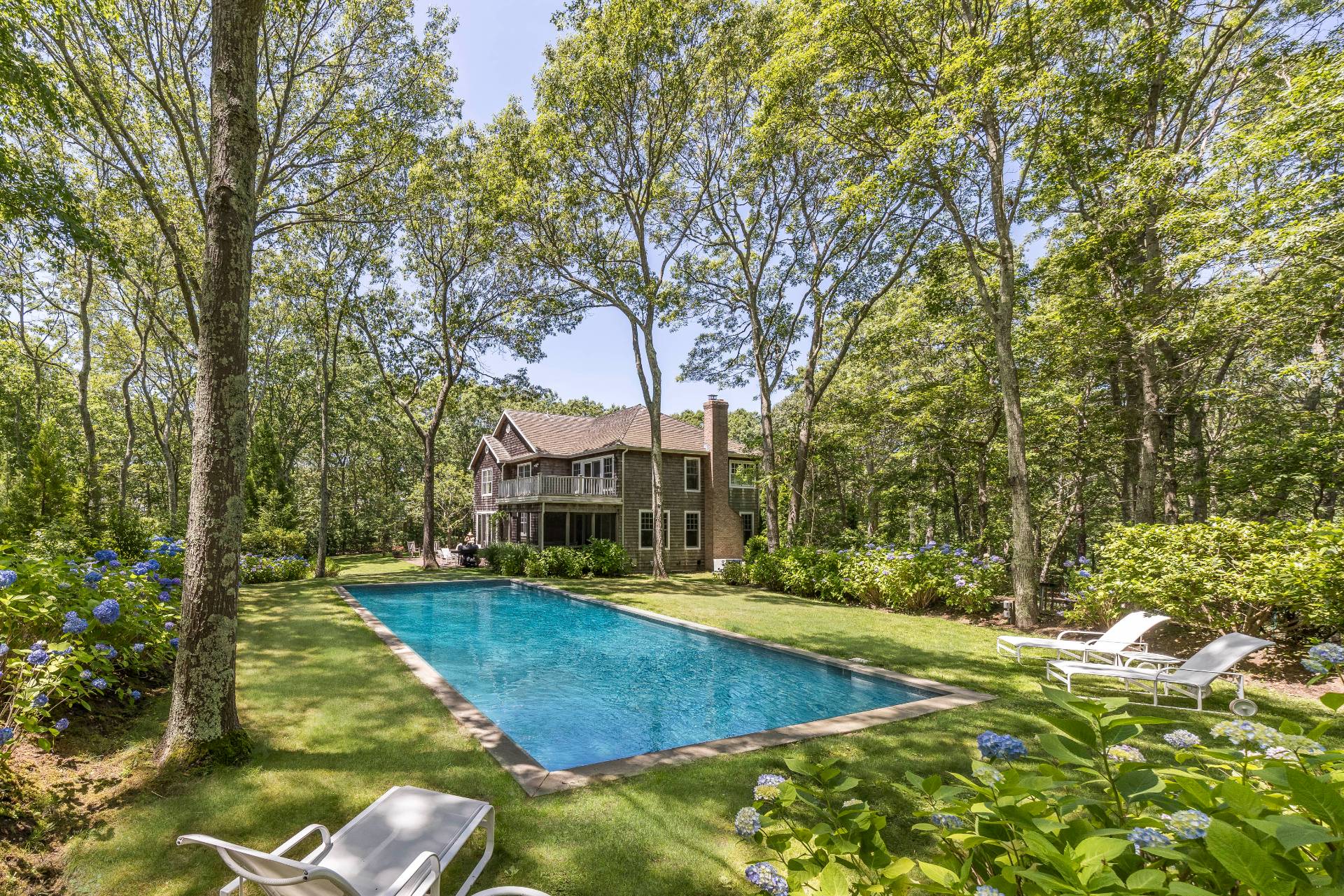 9 Dering Lane East Hampton, NY 11937 - Photo 28 of 30 a view of yard with swimming pool and trees