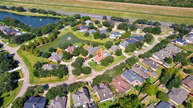 an aerial view of residential house with swimming pool and outdoor space