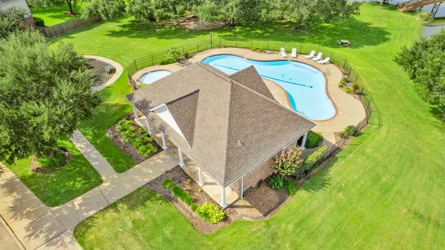 a view of a swimming pool with an outdoor space