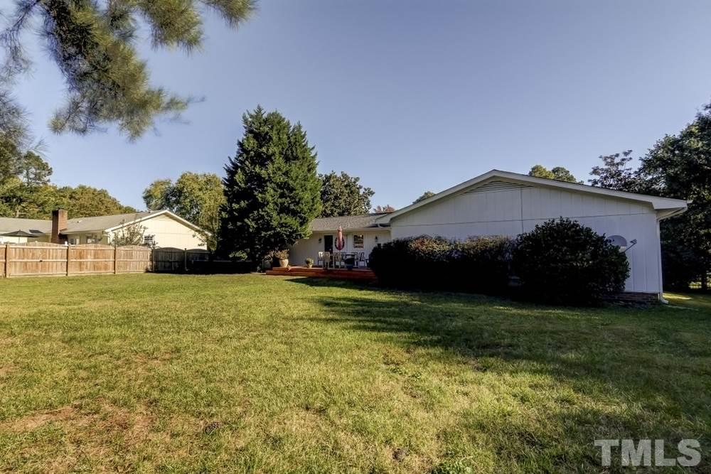 3005 Old Orchard Road Raleigh, NC 27607 - Photo 21 of 21 a view of a house with a yard