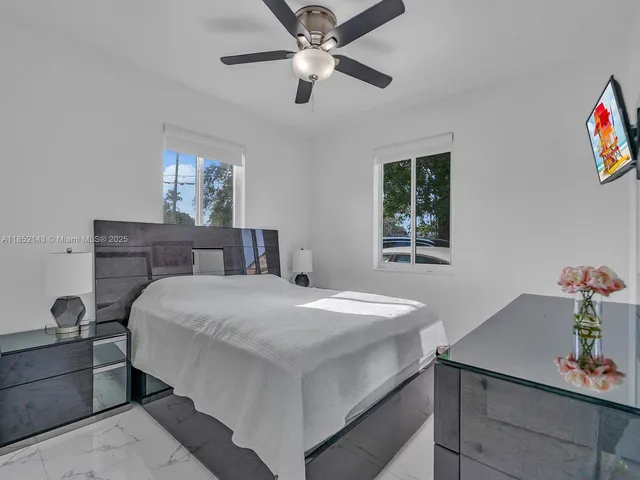 a bedroom with a bed and a dresser