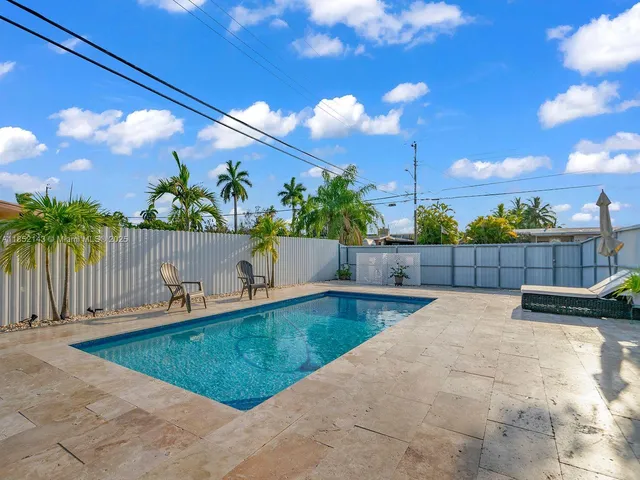 a view of a house with swimming pool