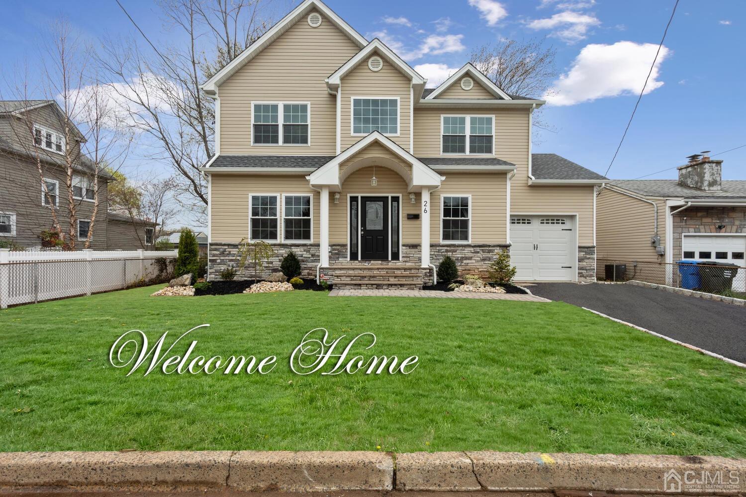 26 Highfield Road Colonia, NJ 07067 - Photo 1 of 30 a front view of a house with a yard