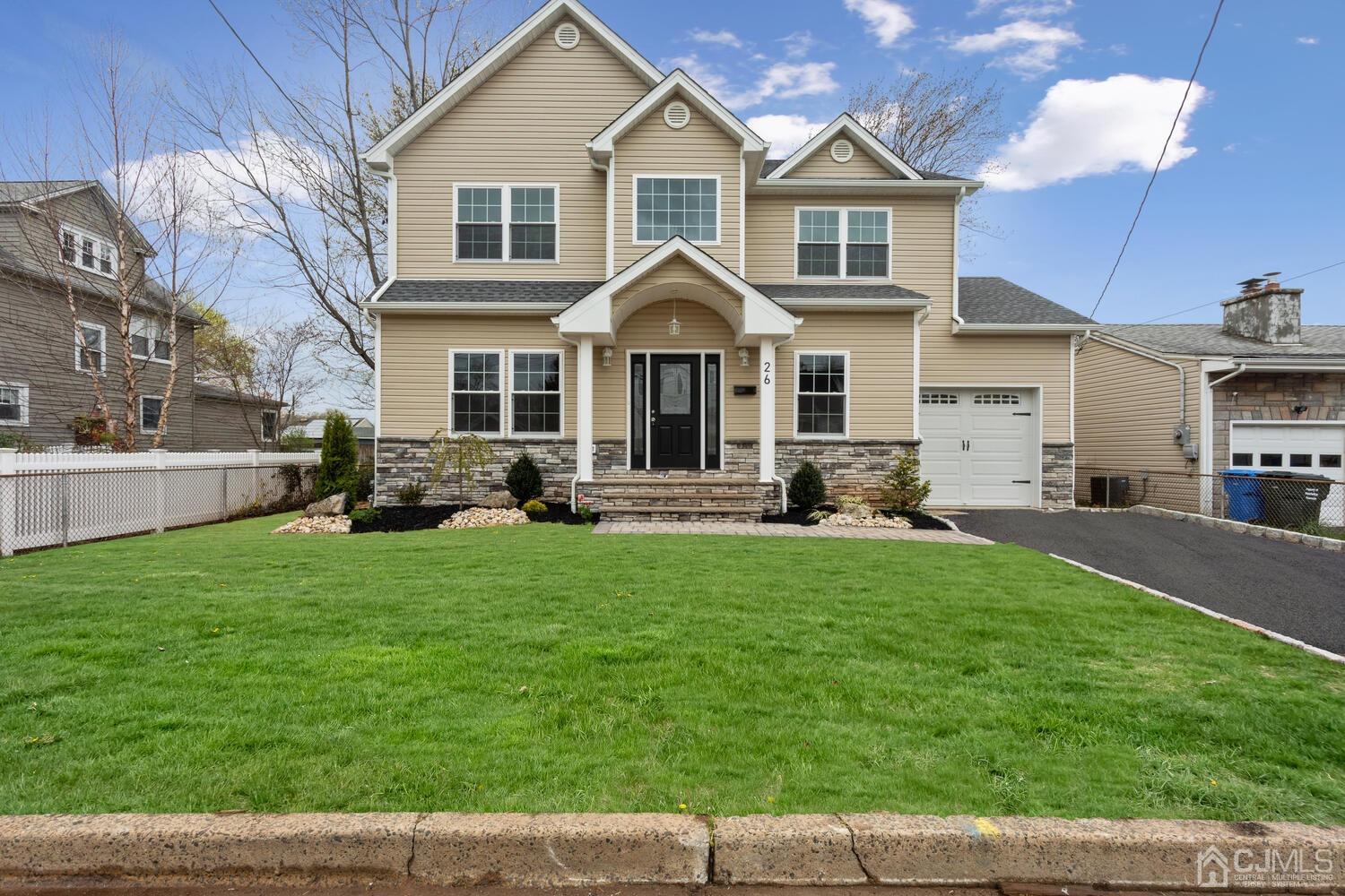 26 Highfield Road Colonia, NJ 07067 - Photo 2 of 30 a front view of a house with a yard