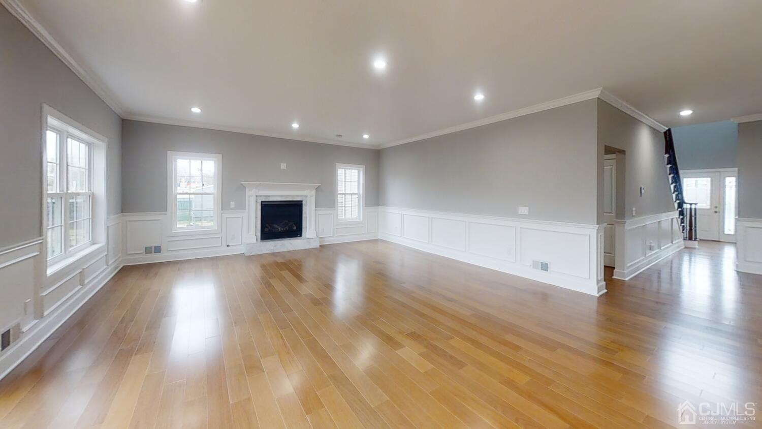 26 Highfield Road Colonia, NJ 07067 - Photo 11 of 30 an empty room with wooden floor and windows