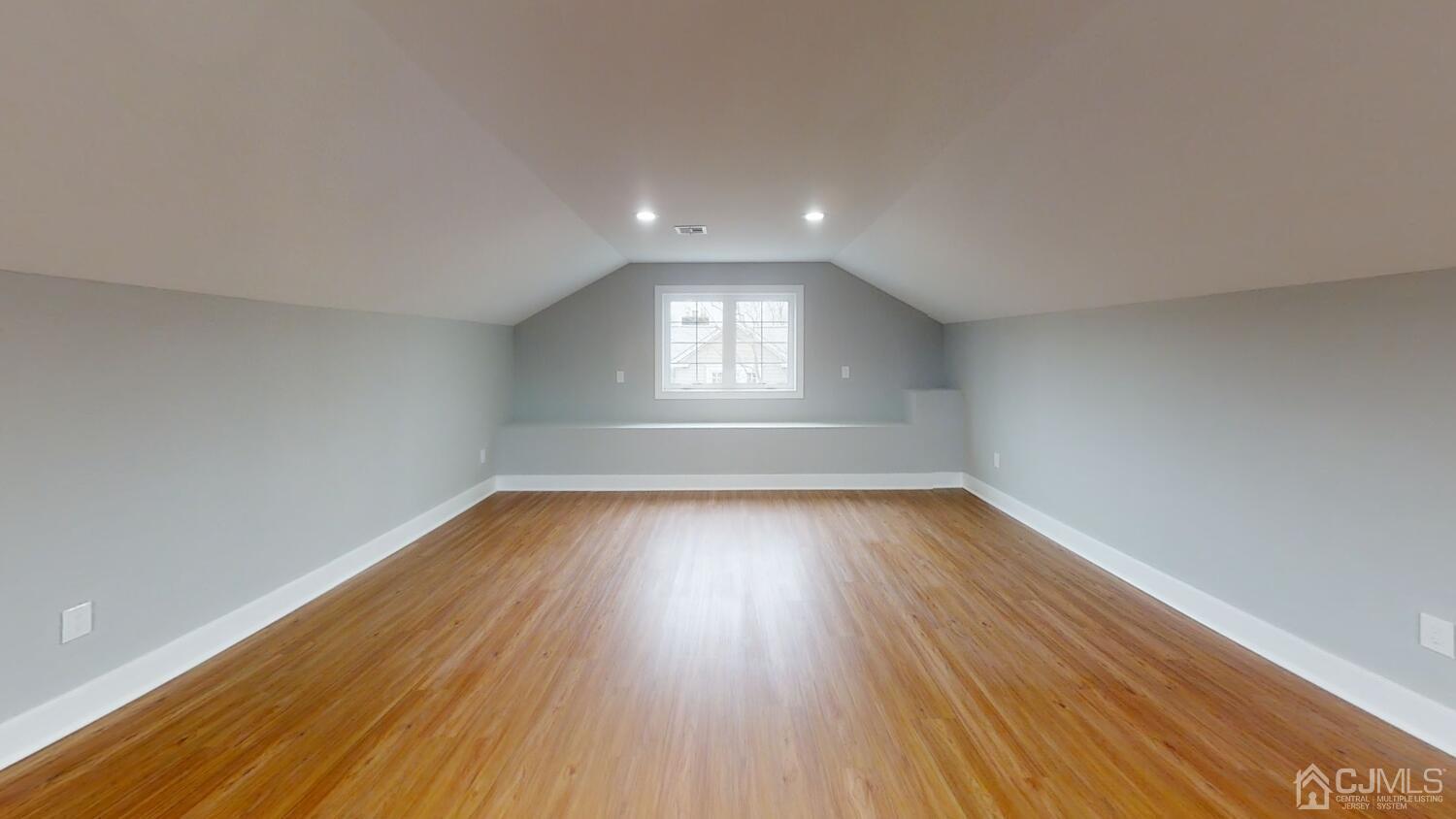 26 Highfield Road Colonia, NJ 07067 - Photo 15 of 30 an empty room with wooden floor and windows