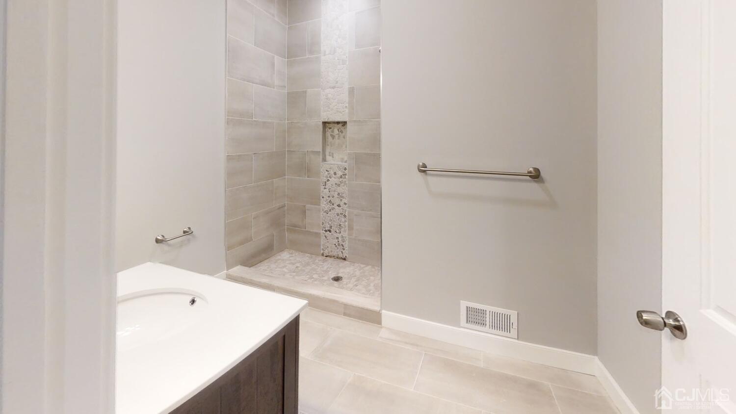 26 Highfield Road Colonia, NJ 07067 - Photo 18 of 30 a bathroom with a sink a toilet and shower
