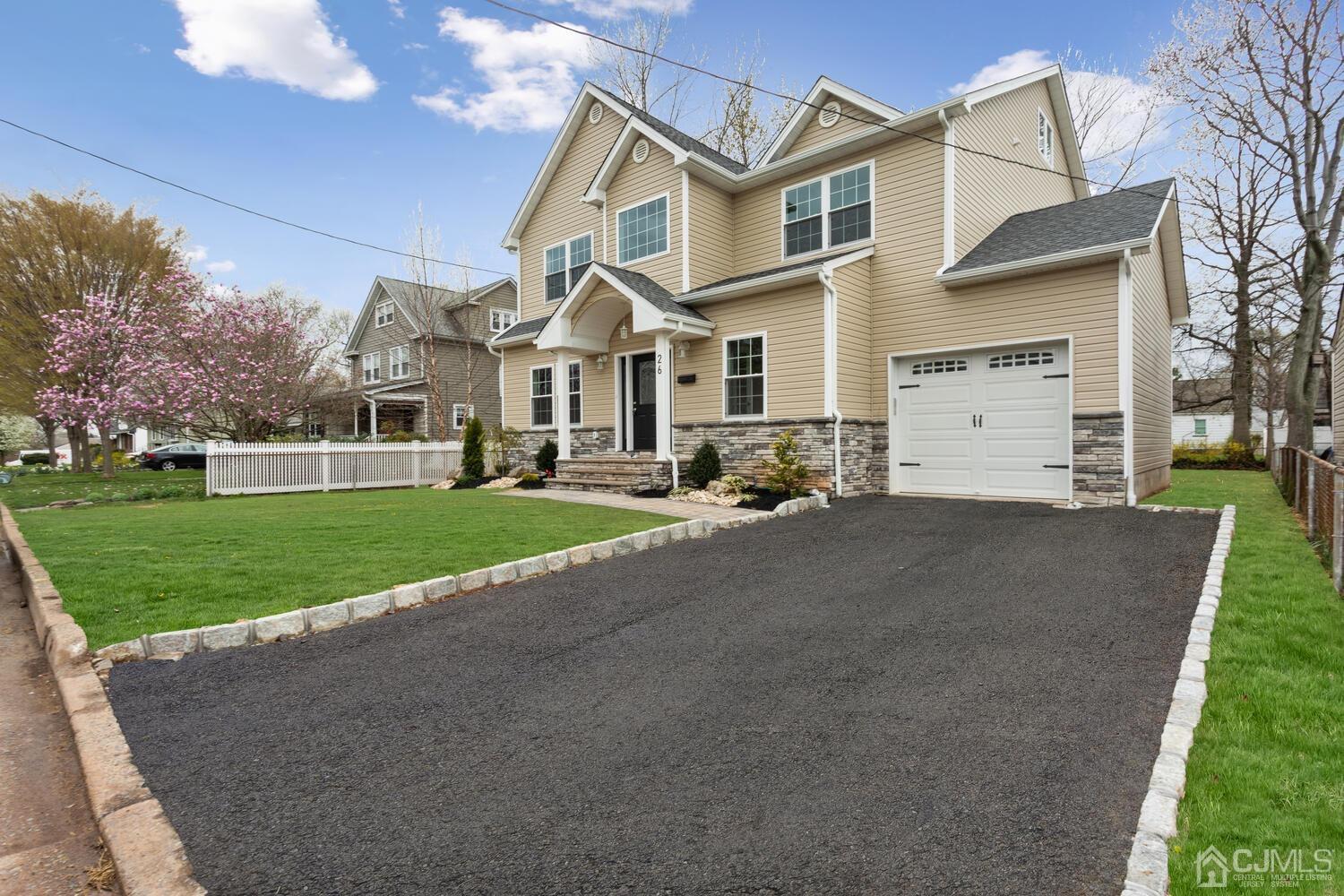 26 Highfield Road Colonia, NJ 07067 - Photo 3 of 30 a front view of house with yard and green space