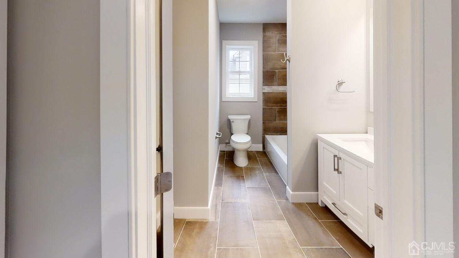 26 Highfield Road Colonia, NJ 07067 - Photo 22 of 30 a bathroom with a toilet and a view of bathroom