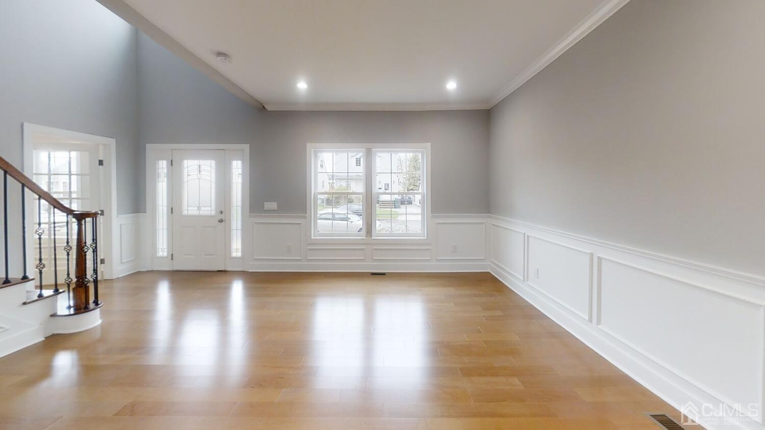 26 Highfield Road Colonia, NJ 07067 - Photo 6 of 30 a view of an empty room with wooden floor and a window