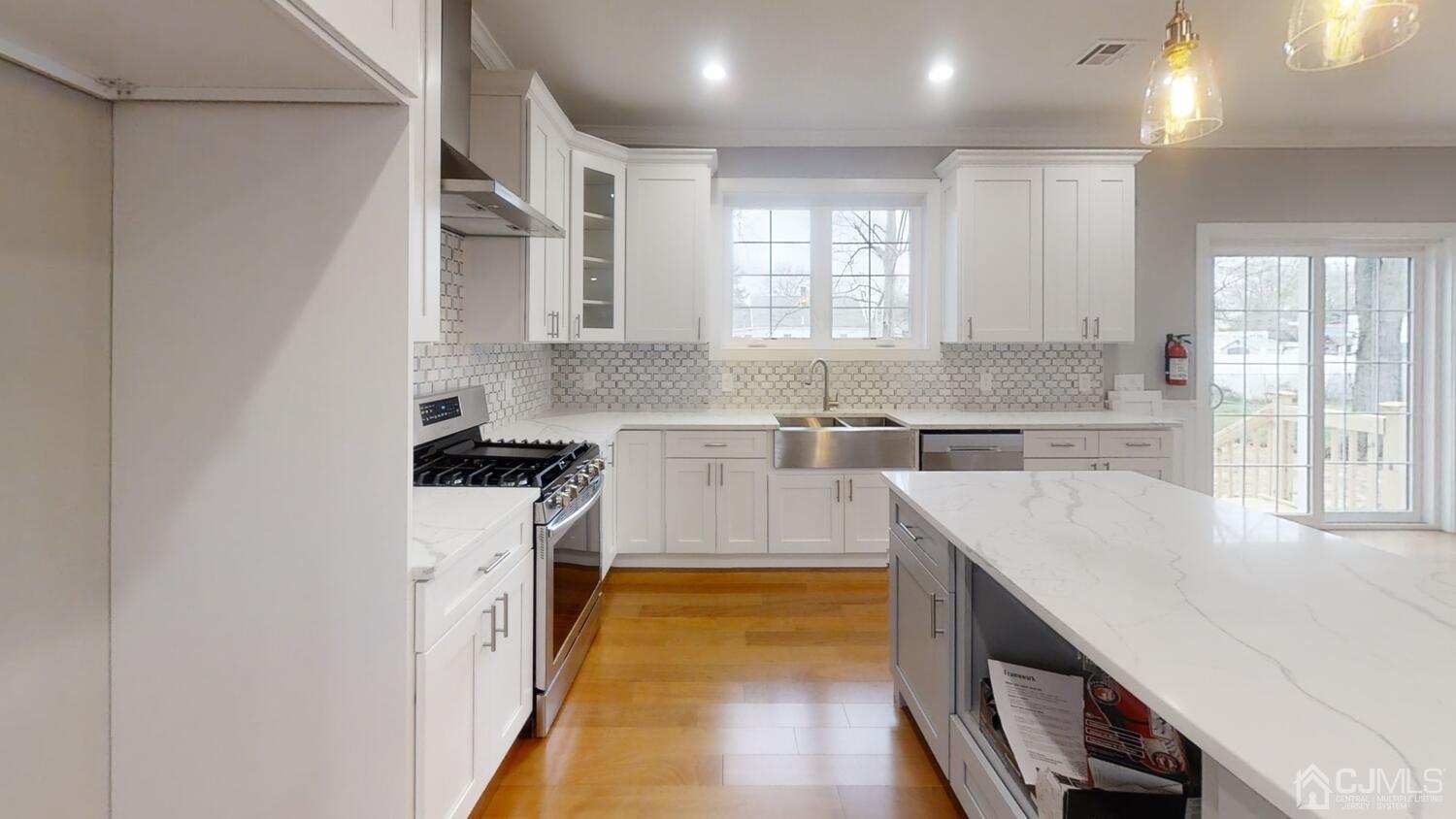 26 Highfield Road Colonia, NJ 07067 - Photo 7 of 30 a kitchen with cabinets a sink and appliances