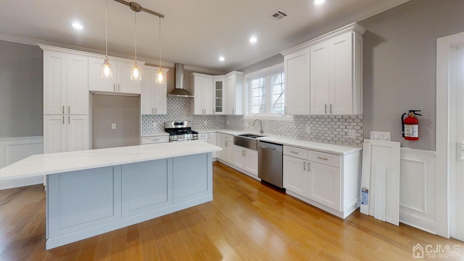 26 Highfield Road Colonia, NJ 07067 - Photo 8 of 30 a kitchen with a sink window and cabinets