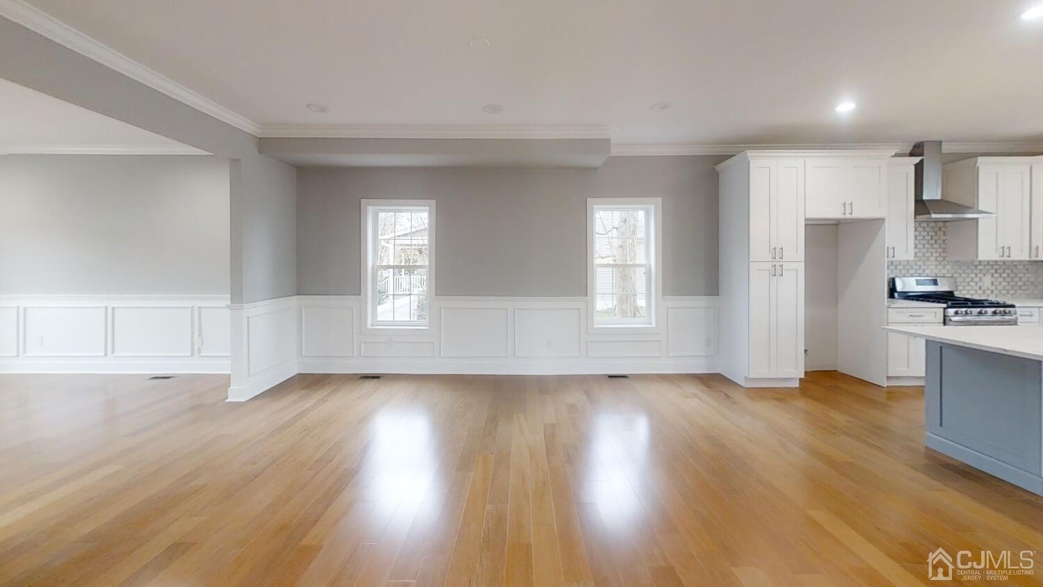 26 Highfield Road Colonia, NJ 07067 - Photo 10 of 30 a view of empty room with wooden floor and kitchen