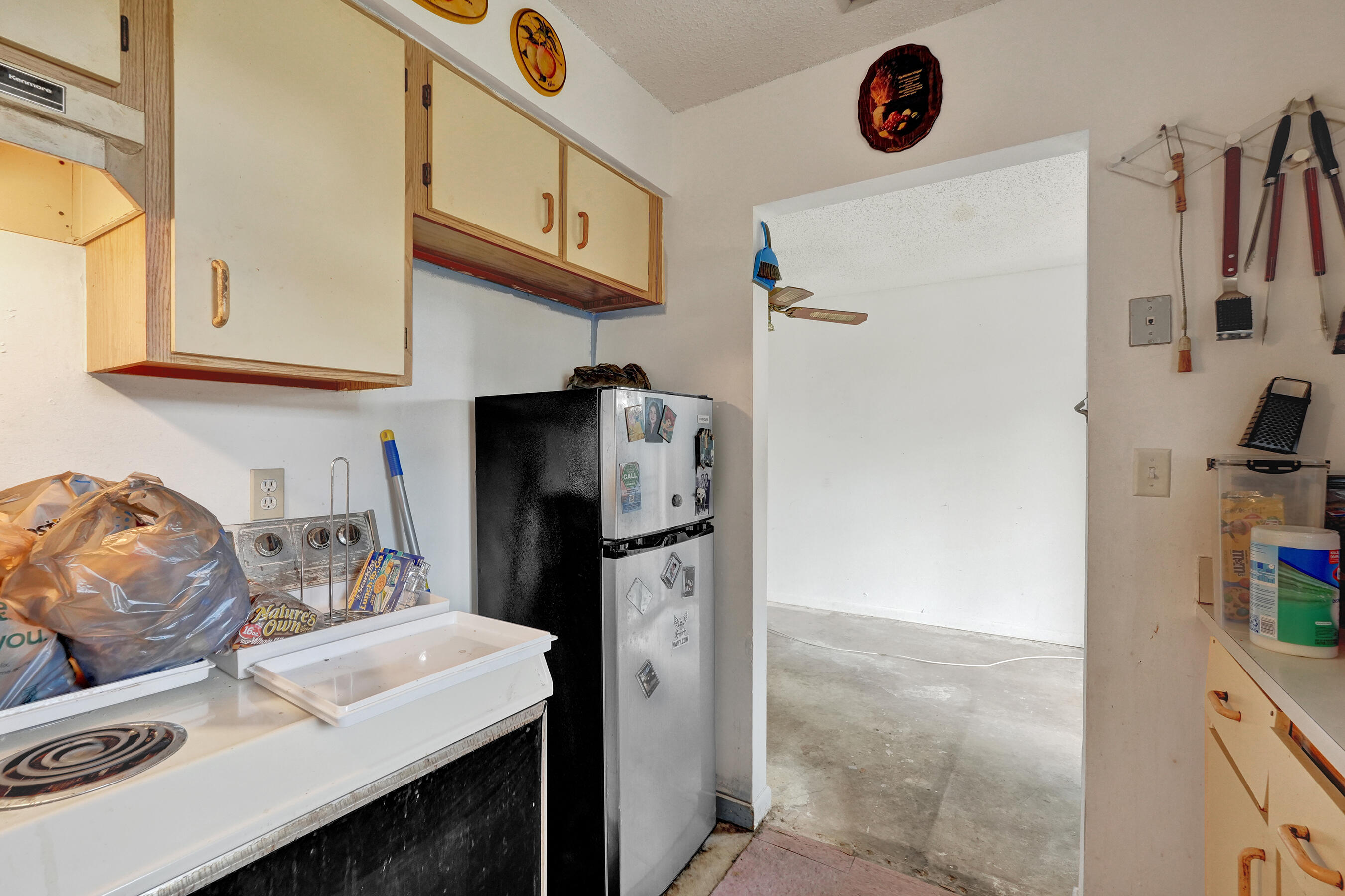 6505 Dockside Circle Greenacres, FL 33463 - Photo 12 of 38 a kitchen with stainless steel appliances a refrigerator and a sink