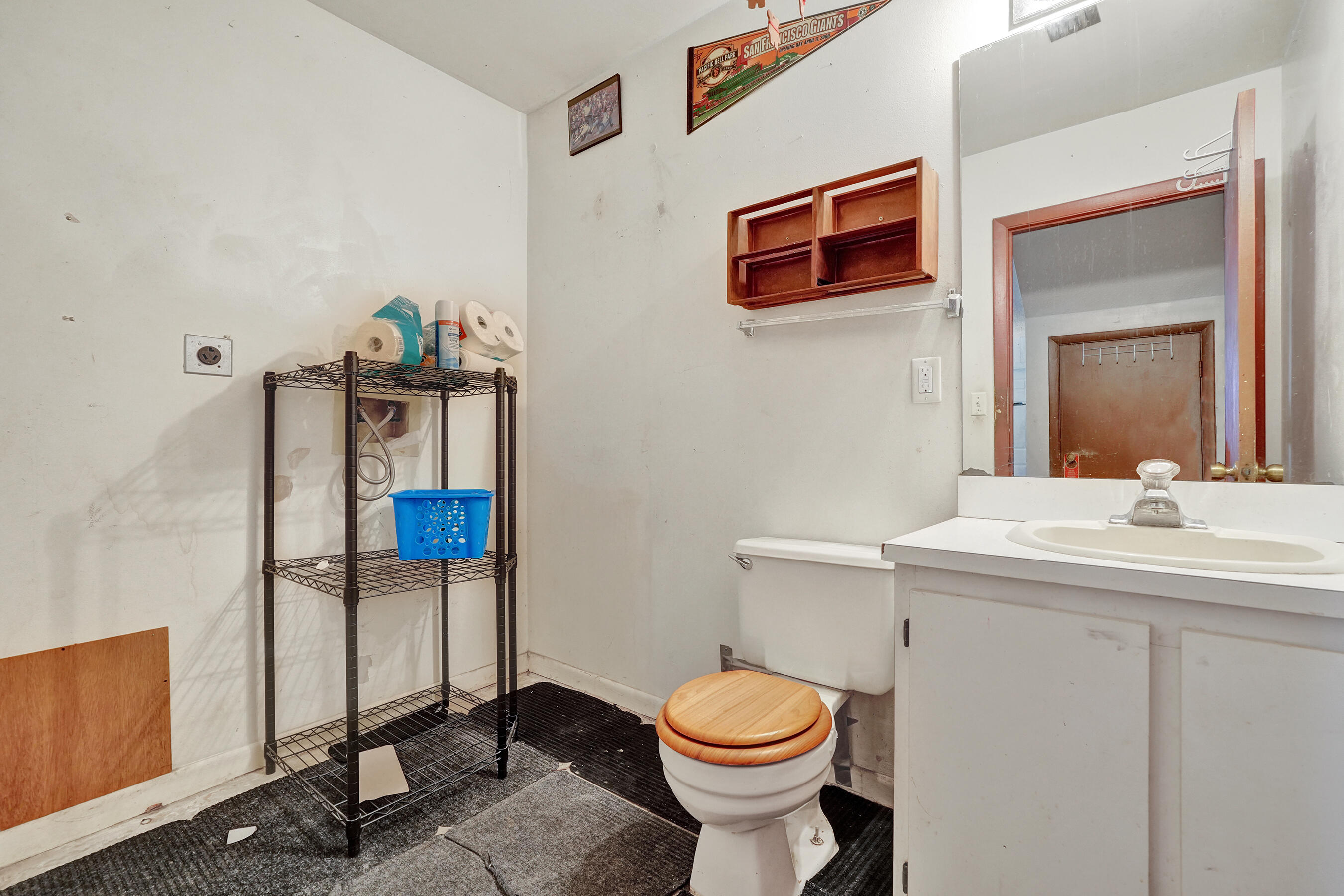6505 Dockside Circle Greenacres, FL 33463 - Photo 15 of 38 a bathroom with a toilet sink and mirror