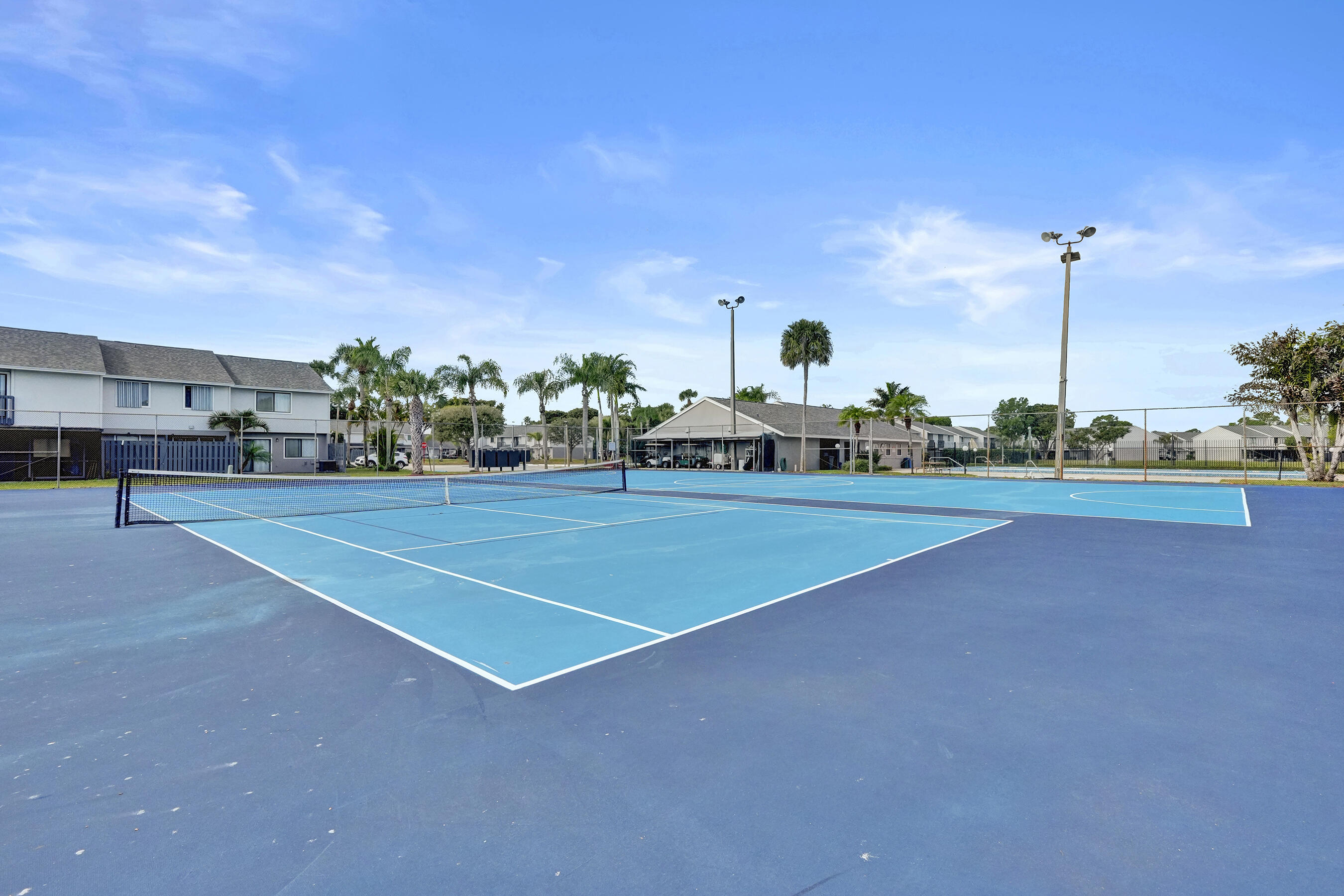 6505 Dockside Circle Greenacres, FL 33463 - Photo 21 of 38 a view of a tennis court