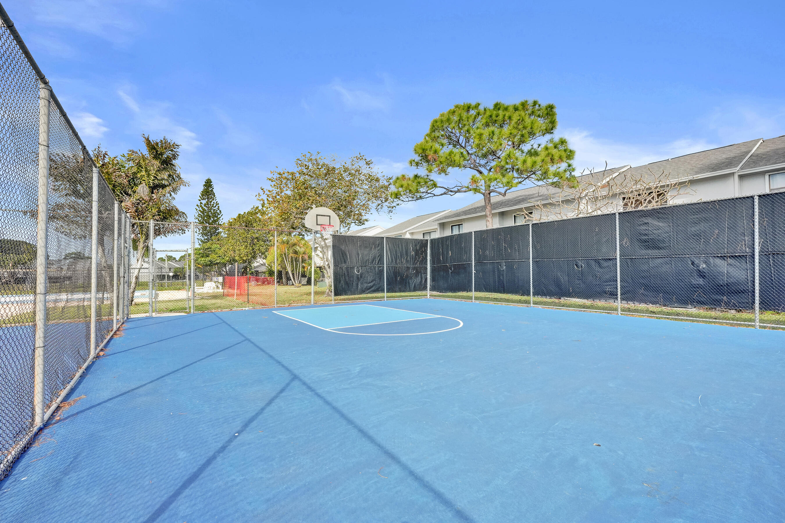 6505 Dockside Circle Greenacres, FL 33463 - Photo 22 of 38 a view of a house with a yard and basket ball court