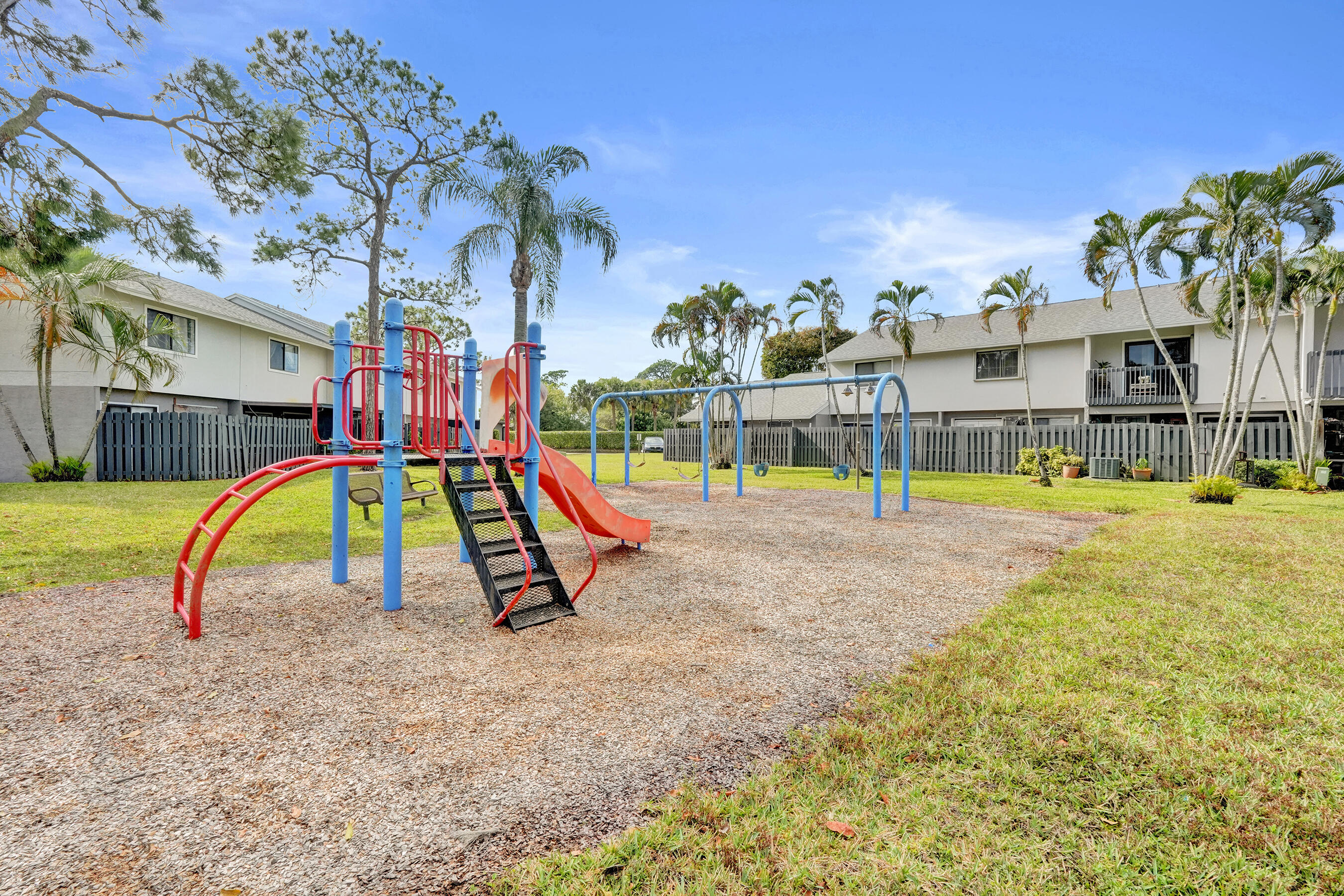6505 Dockside Circle Greenacres, FL 33463 - Photo 25 of 38 a view of a swimming pool with a backyard and a palm tree