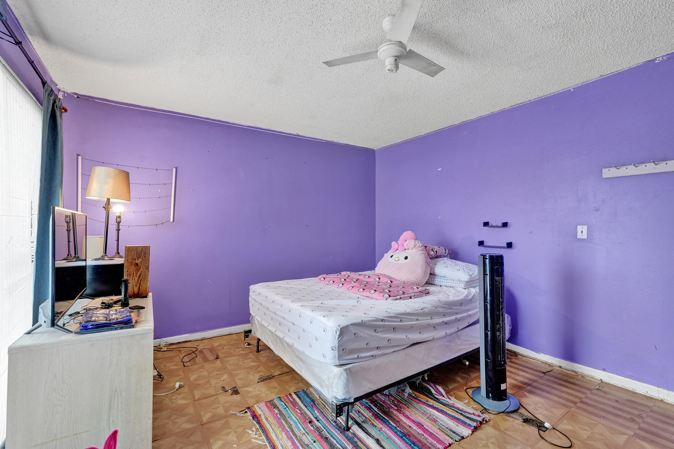 6505 Dockside Circle Greenacres, FL 33463 - Photo 28 of 38 a bedroom with a bed and a bookshelf