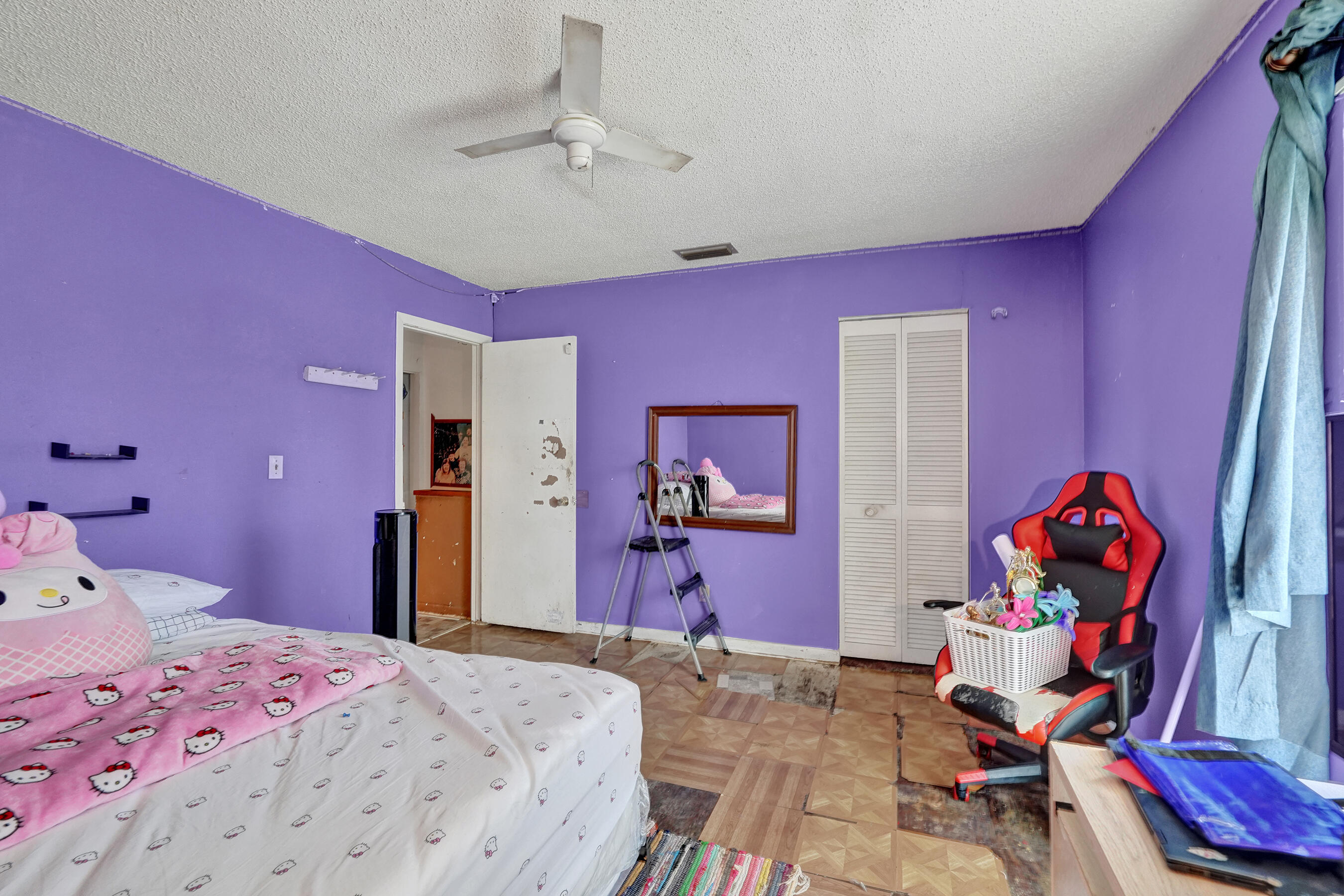 6505 Dockside Circle Greenacres, FL 33463 - Photo 29 of 38 a bedroom with a bed and a chair