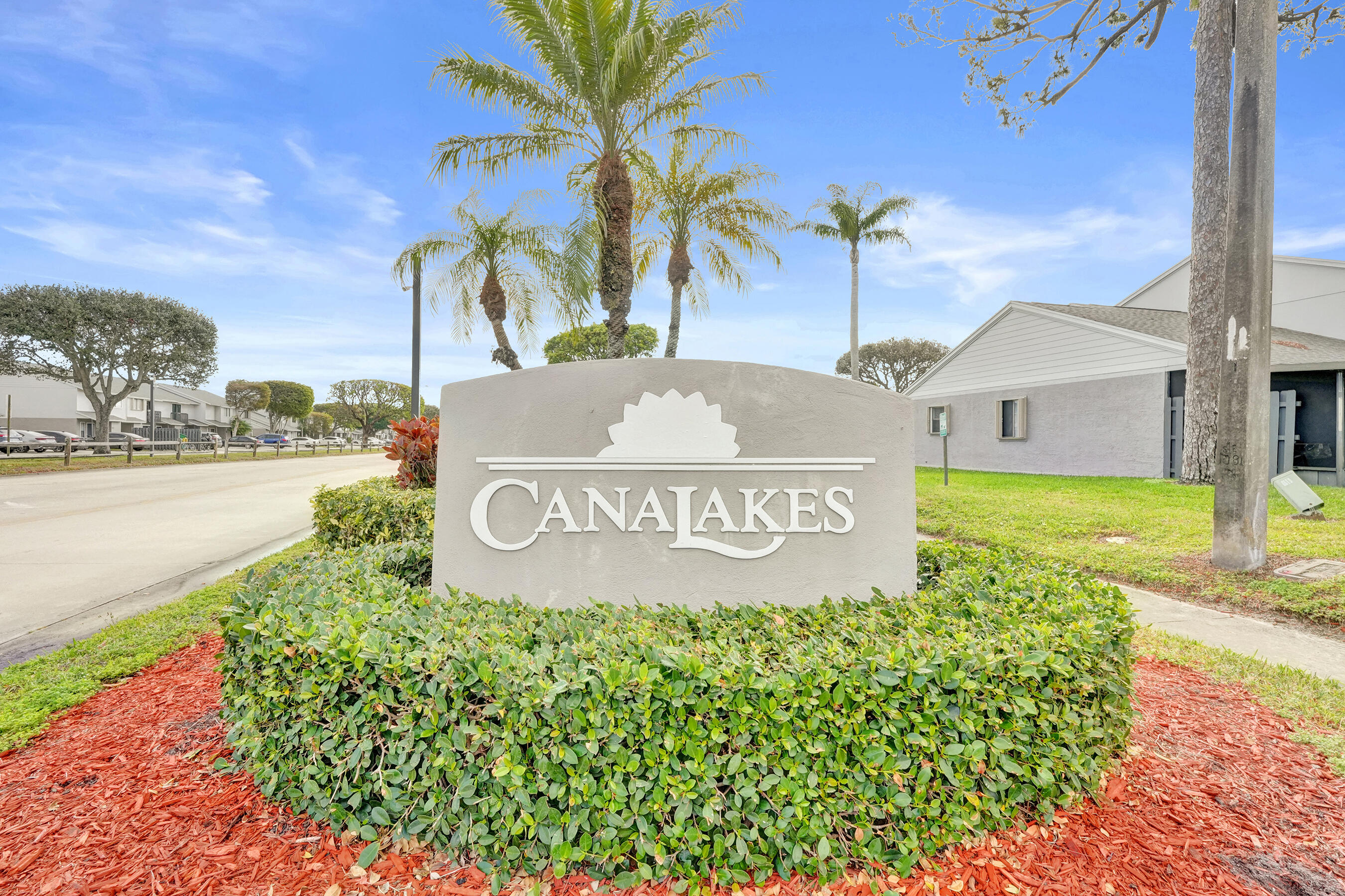 6505 Dockside Circle Greenacres, FL 33463 - Photo 37 of 38 a sign broad on the side of the road
