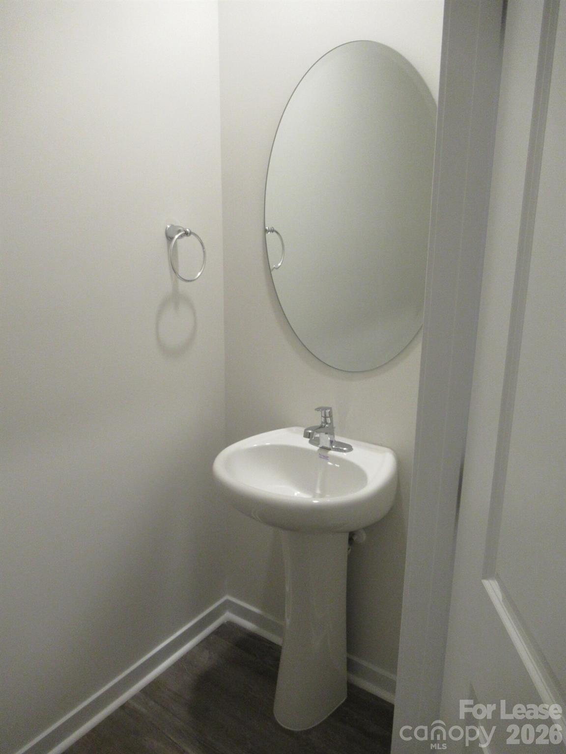 3192 Ora Smith Road Lincolnton, NC 28092 - Photo 11 of 34 a bathroom with a sink a mirror and vanity