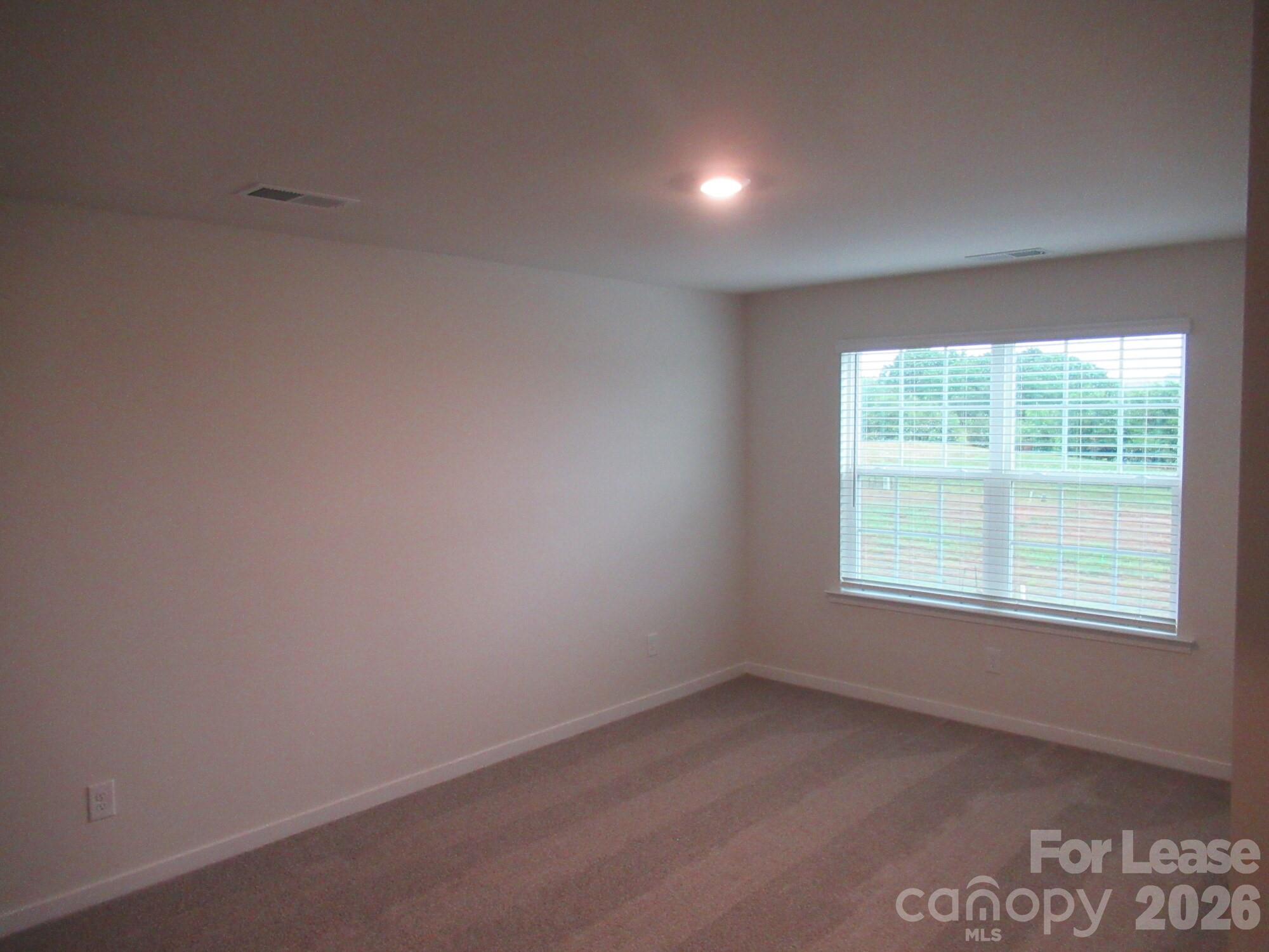 3192 Ora Smith Road Lincolnton, NC 28092 - Photo 14 of 34 an empty room with a window