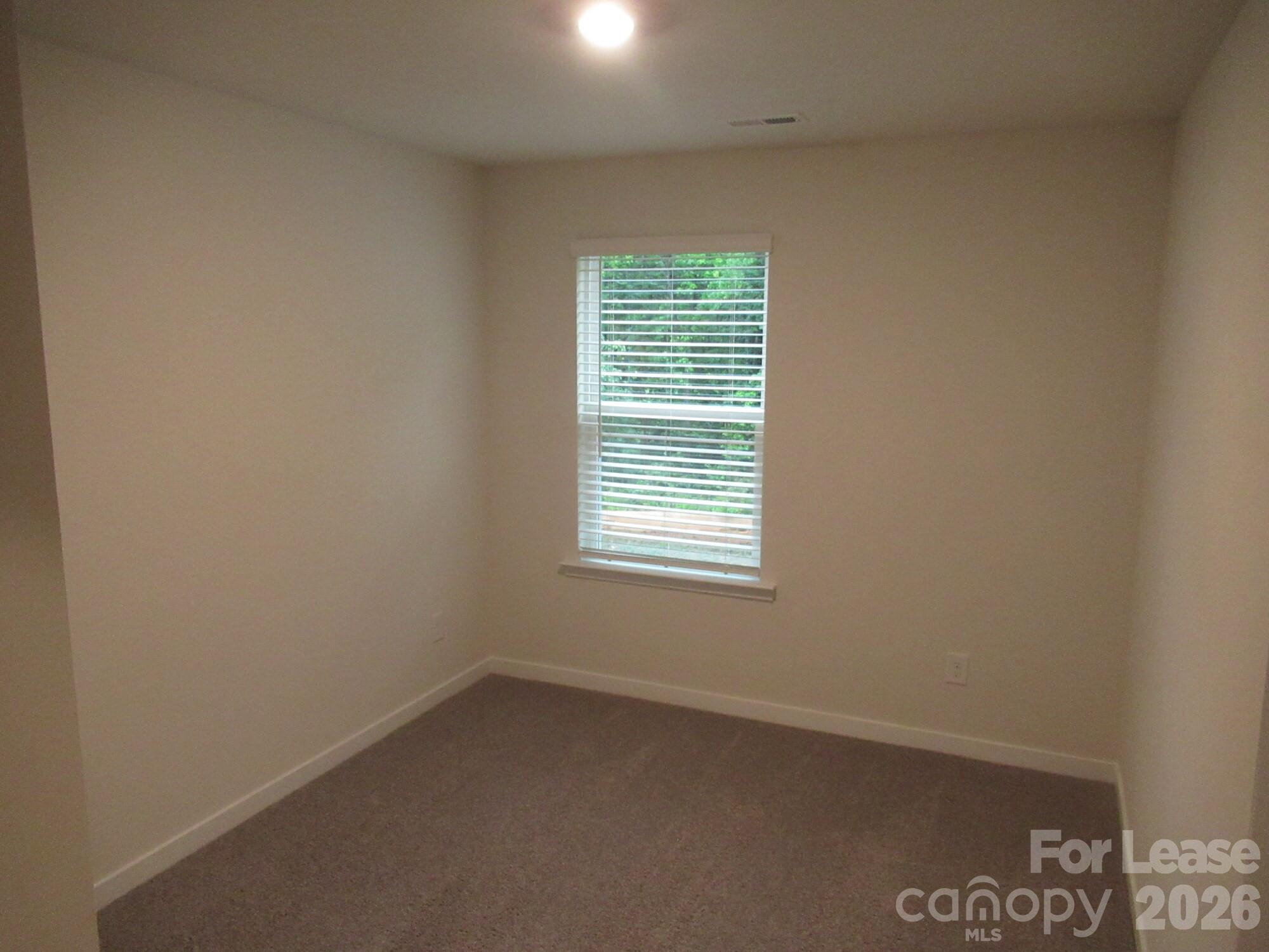 3192 Ora Smith Road Lincolnton, NC 28092 - Photo 18 of 34 an empty room with a window