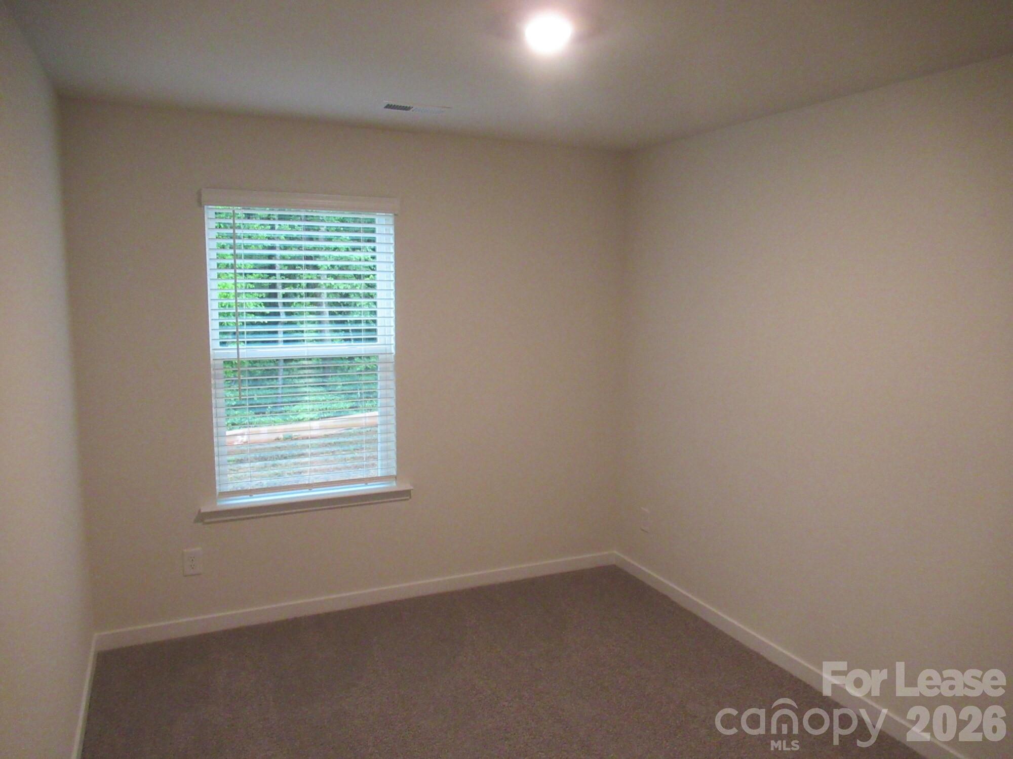 3192 Ora Smith Road Lincolnton, NC 28092 - Photo 21 of 34 an empty room with a window
