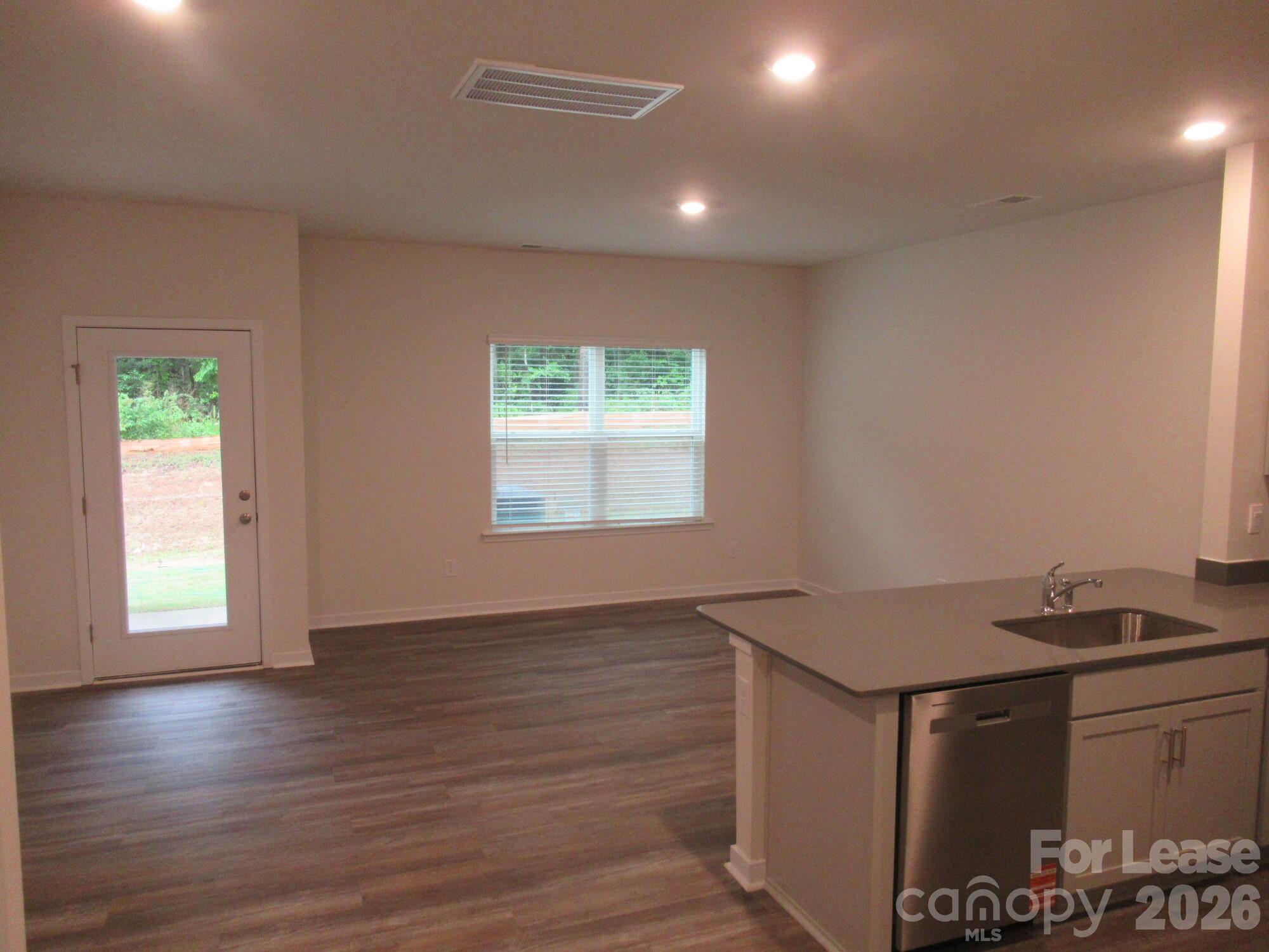 3192 Ora Smith Road Lincolnton, NC 28092 - Photo 4 of 34 a view of an empty room with window and wooden floor
