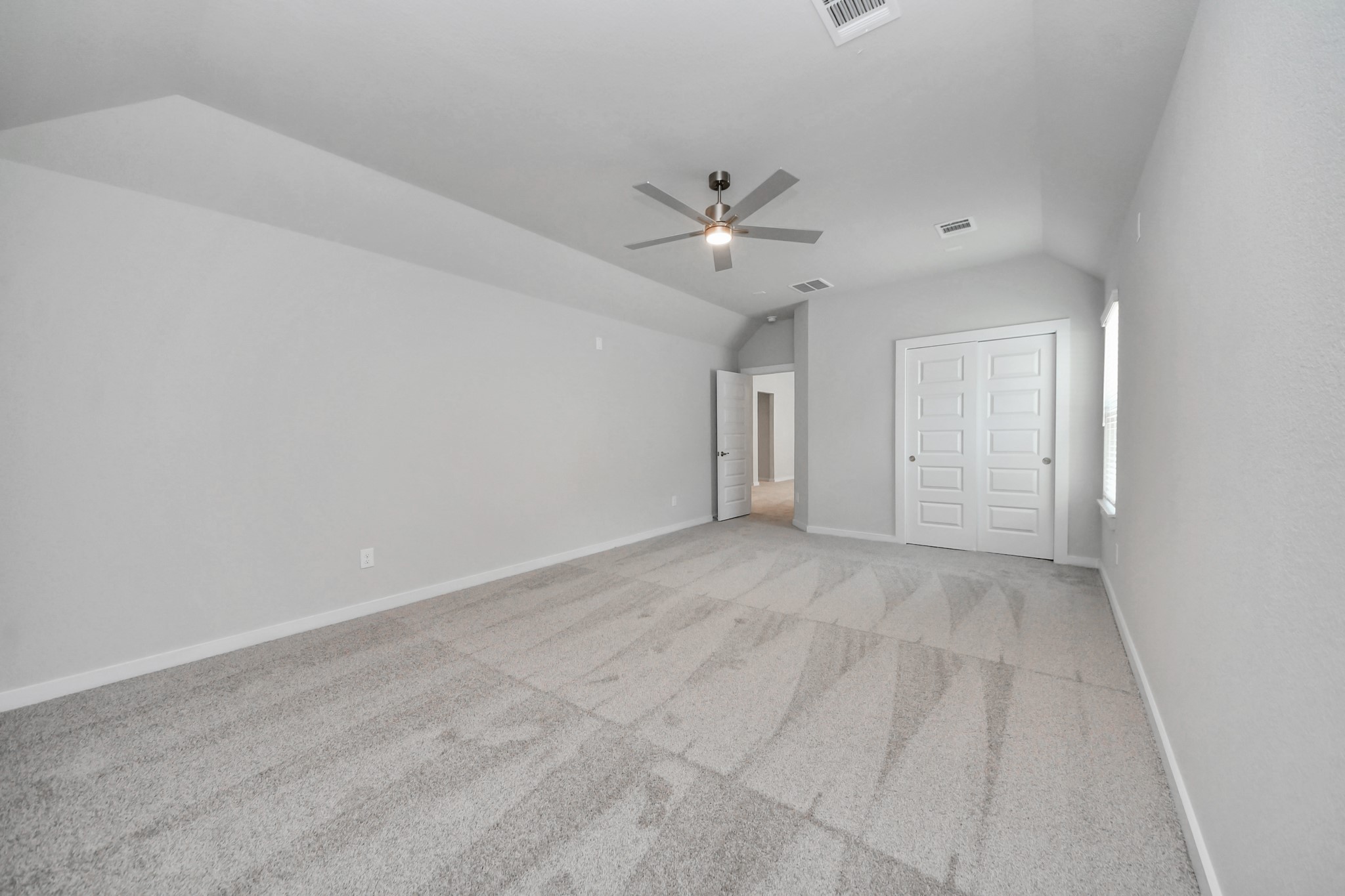 3110 Native Spg Drive Spring, TX 77373 - Photo 28 of 34 Generously sized secondary bedrooms featuring spacious closets, soft and inviting carpeting underfoot, large windows allowing plenty of natural light, and the added touch of privacy blinds for your personal retreat. Sample photo of completed home with similar floor plan. Actual colors and selections may vary.