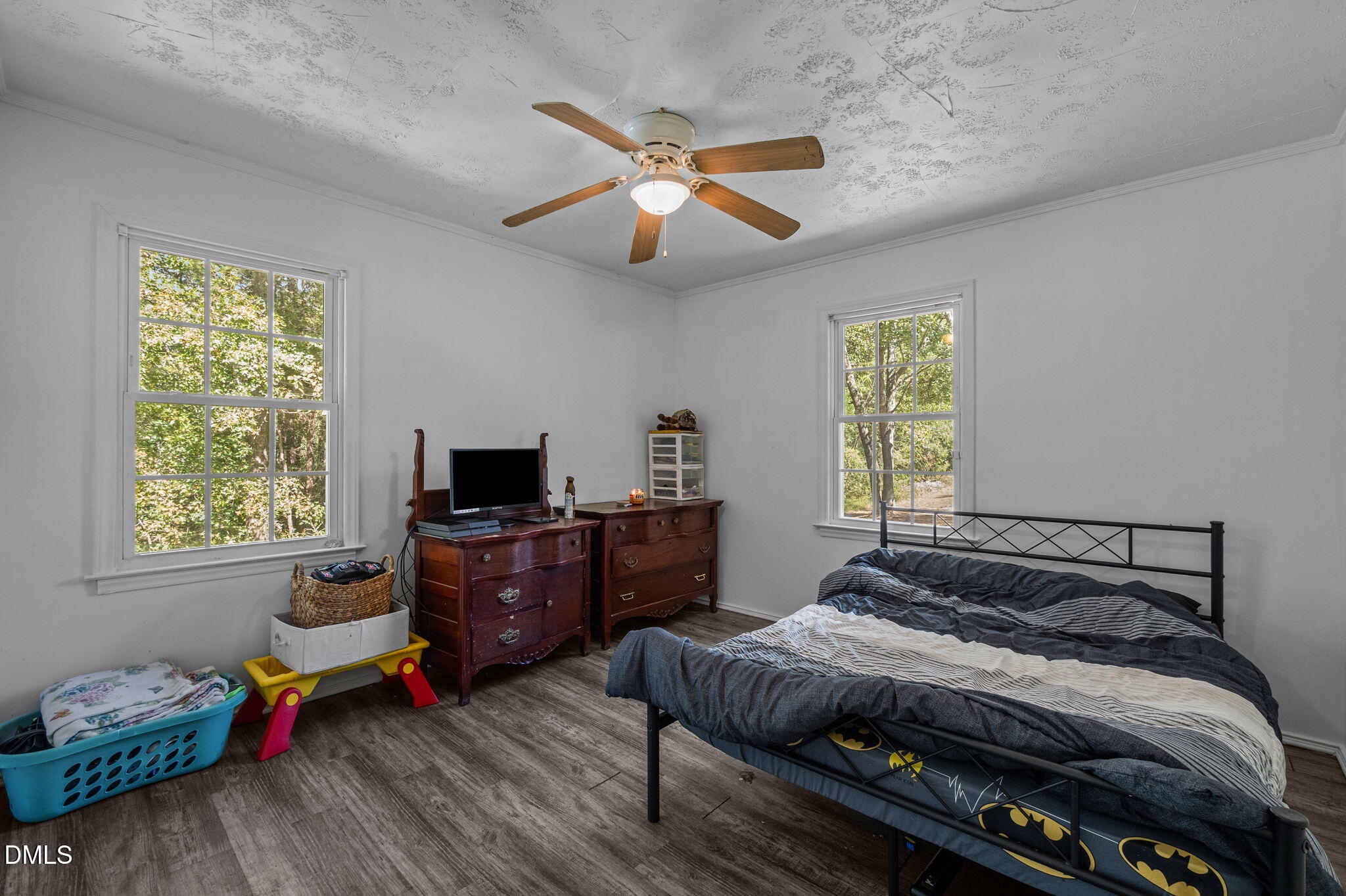 670 Tingen Mine Road Roxboro, NC 27574 - Photo 14 of 30 a bedroom with a bed and wooden floor