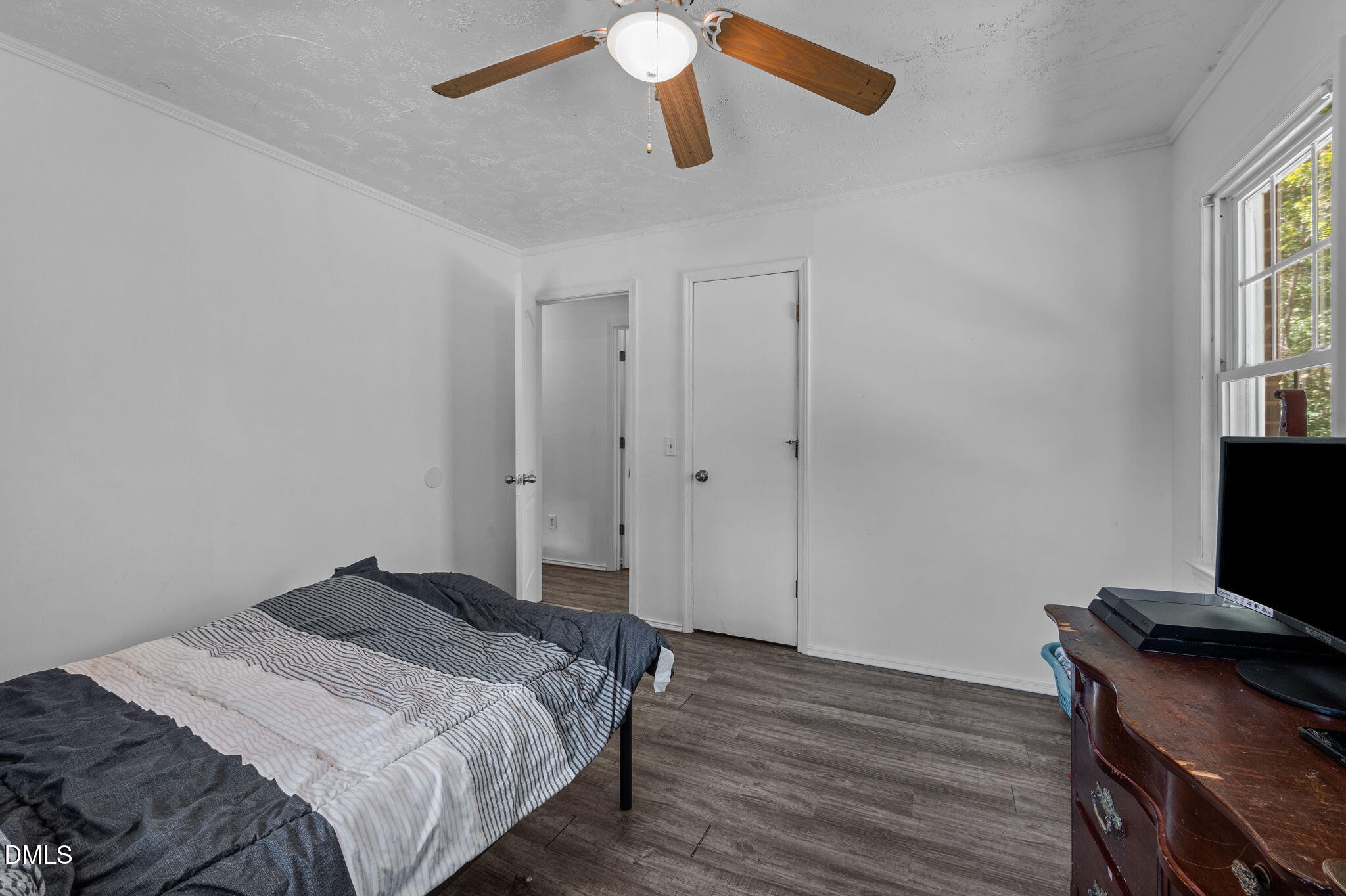 670 Tingen Mine Road Roxboro, NC 27574 - Photo 15 of 30 a bedroom with a bed and a flat screen tv