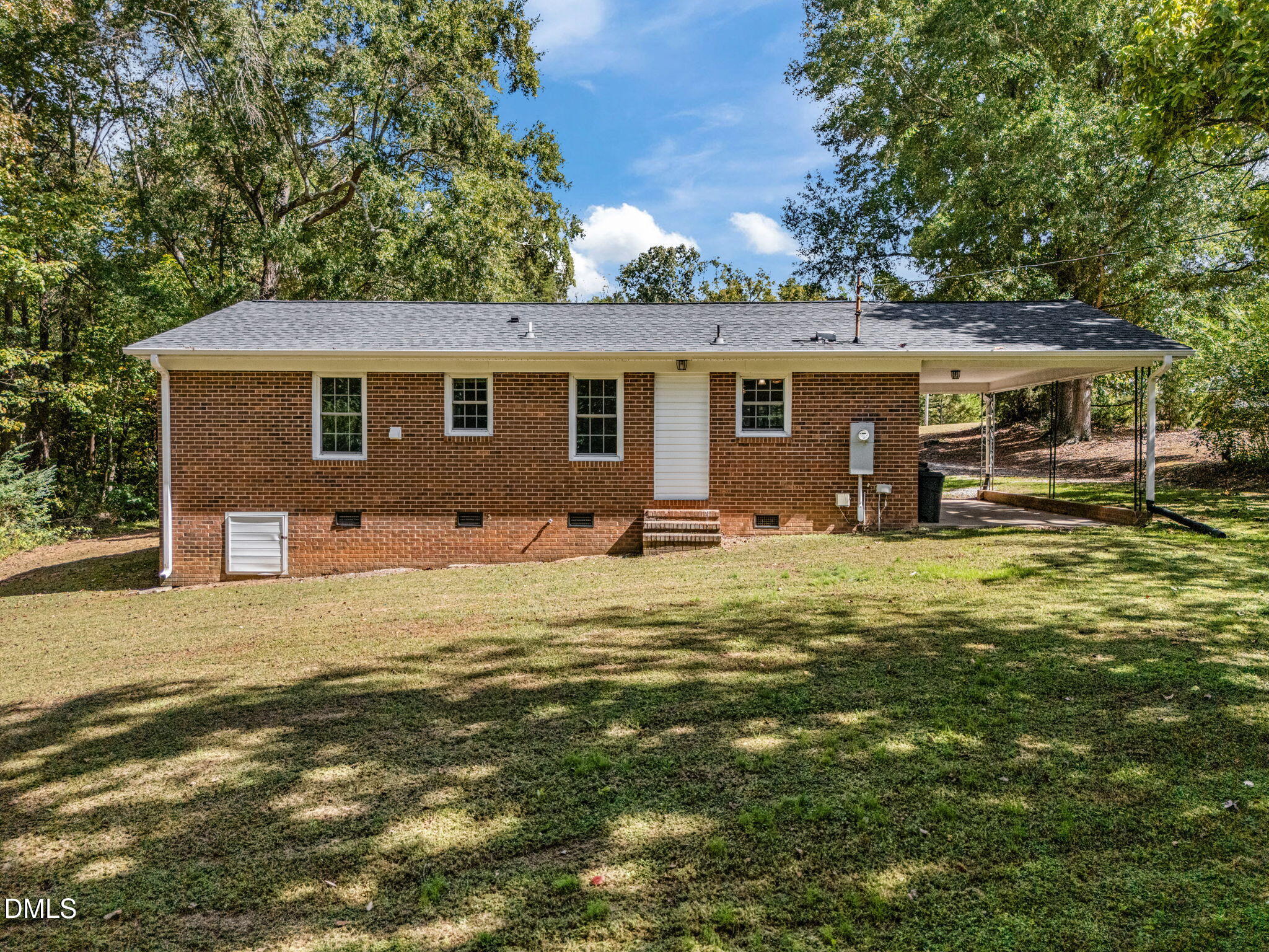 670 Tingen Mine Road Roxboro, NC 27574 - Photo 19 of 30 a front view of house with yard and trees in the background