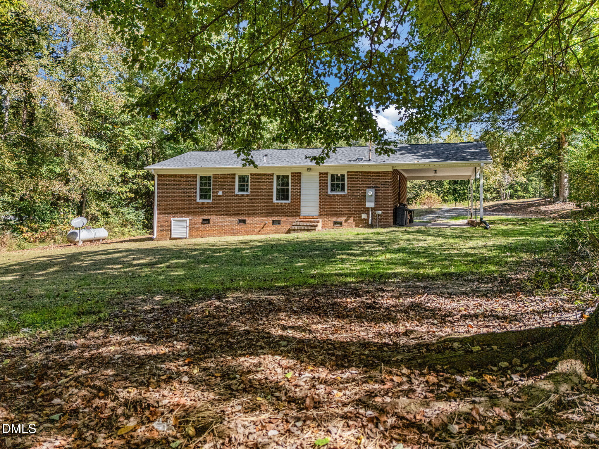 670 Tingen Mine Road Roxboro, NC 27574 - Photo 22 of 30 a house with green field in front of it