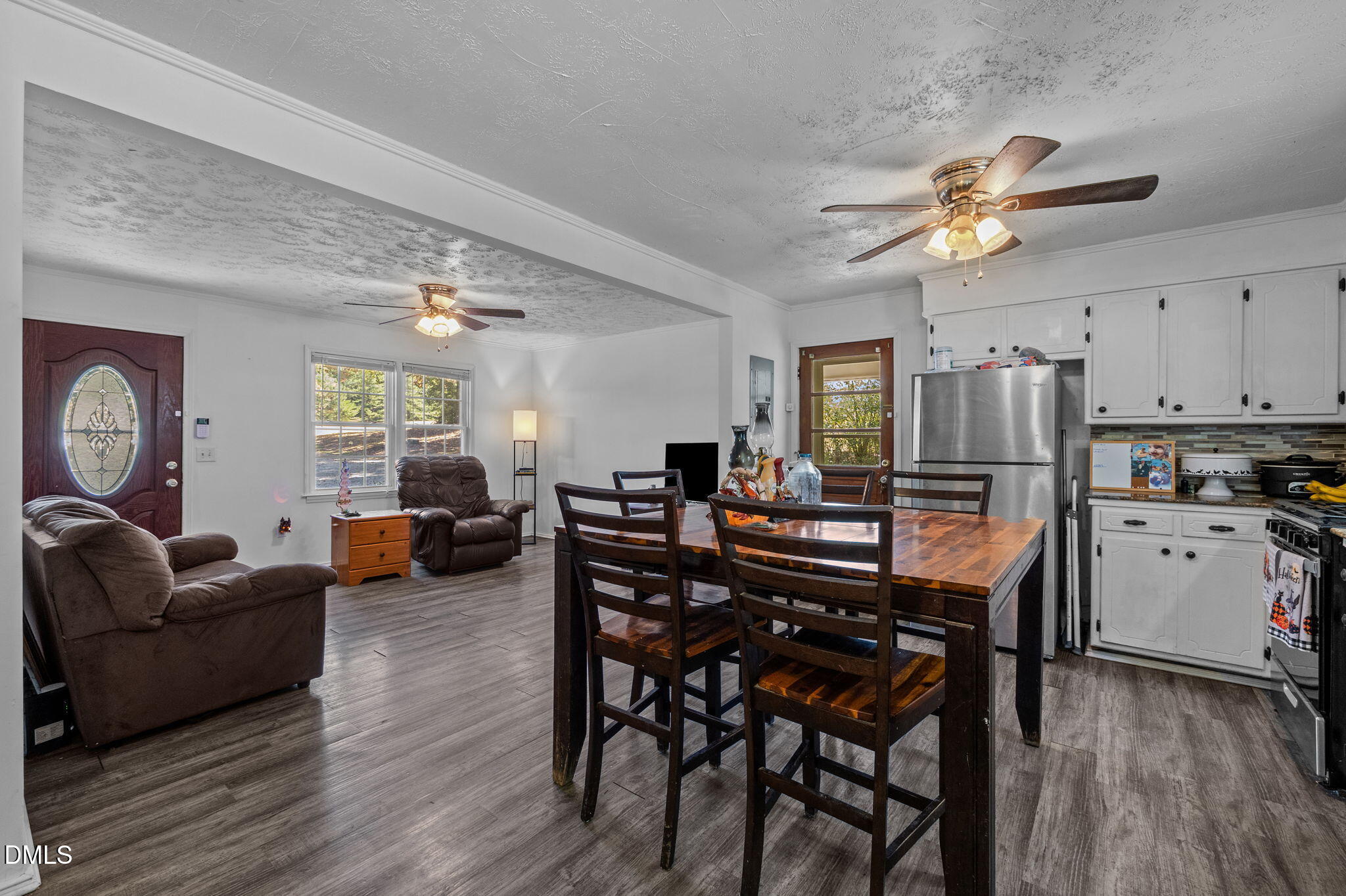 670 Tingen Mine Road Roxboro, NC 27574 - Photo 4 of 30 a view of kitchen with cabinets and wooden floor