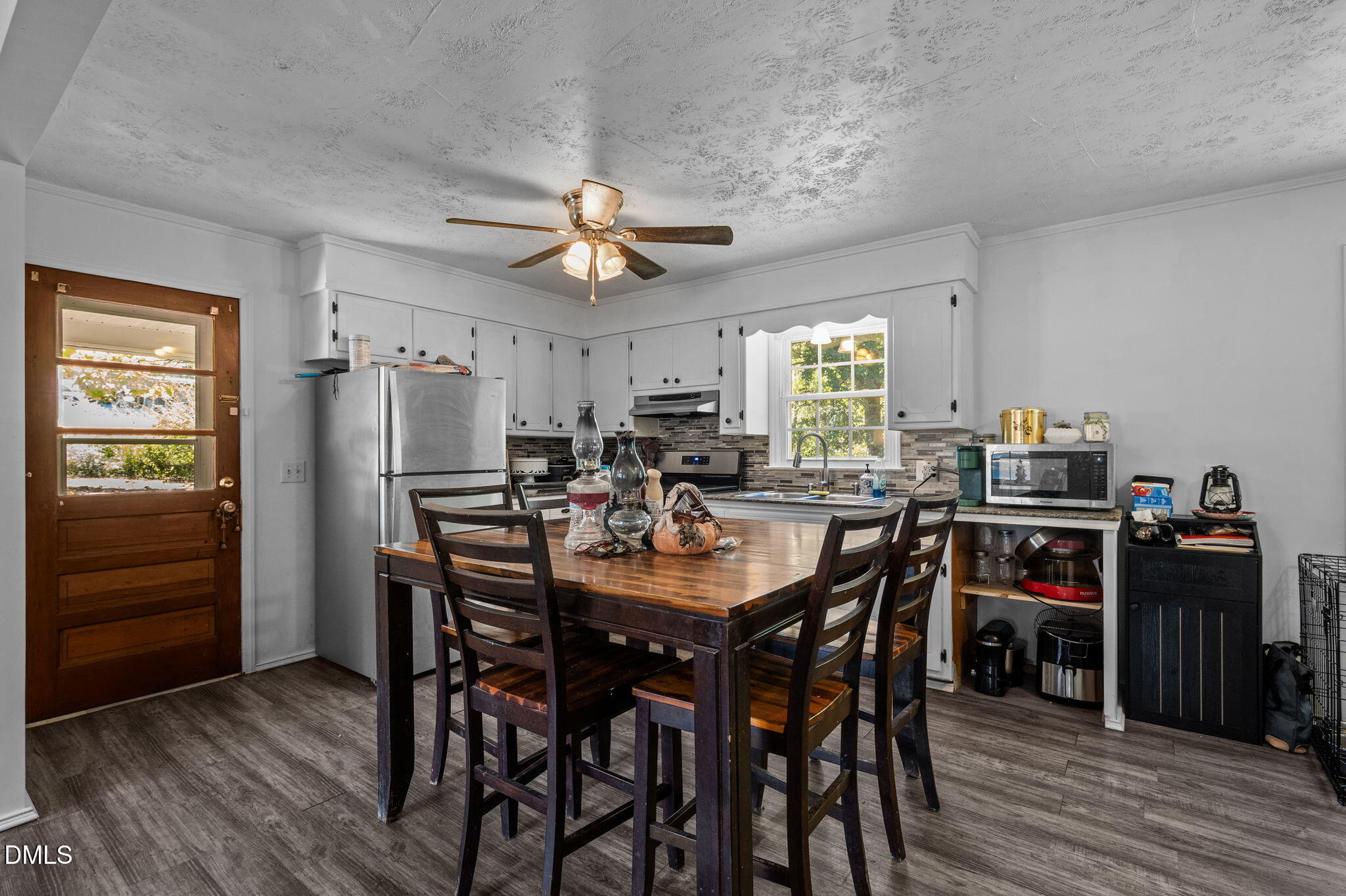 670 Tingen Mine Road Roxboro, NC 27574 - Photo 5 of 30 a view of a dining room with furniture and wooden floor