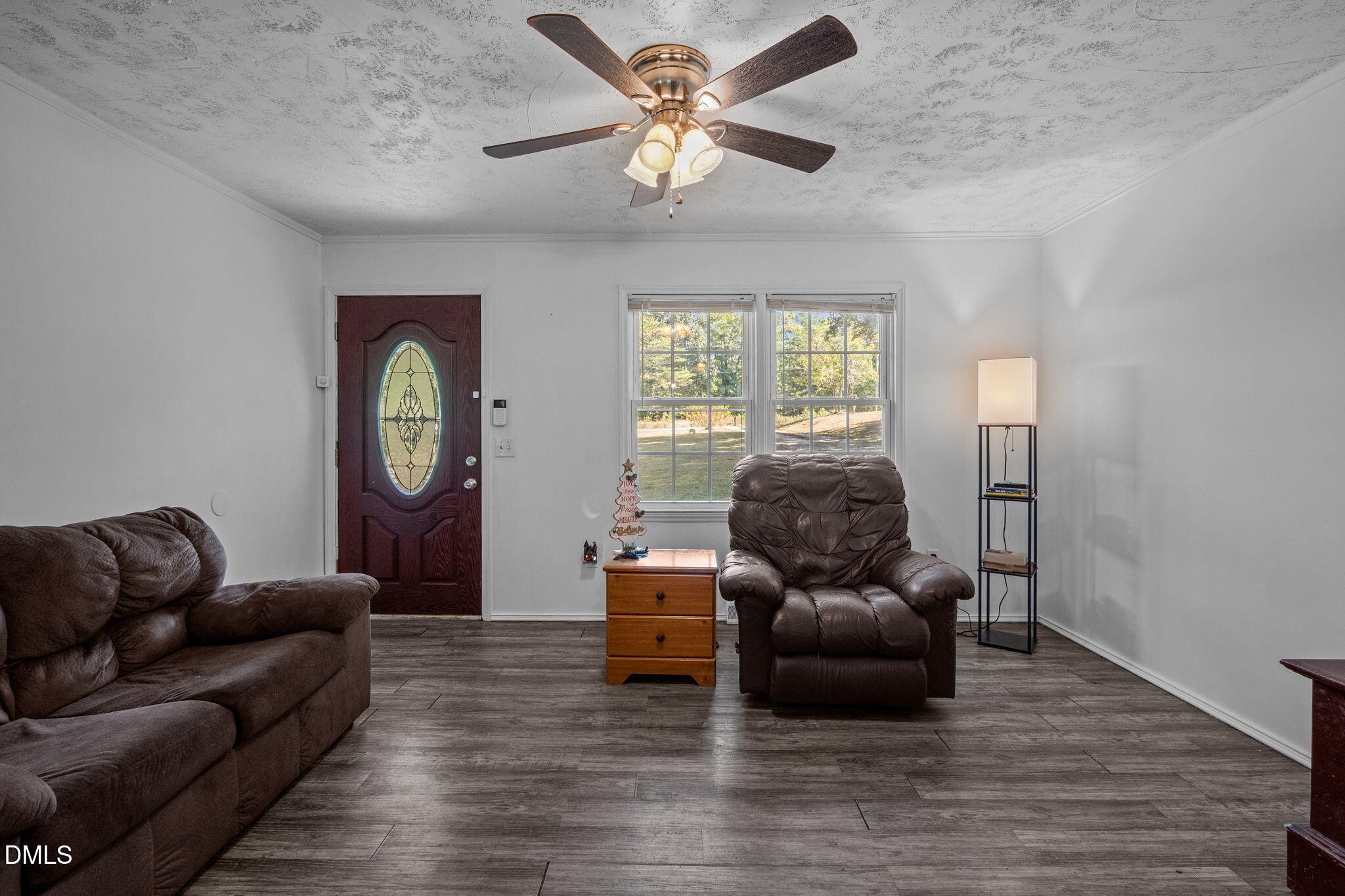 670 Tingen Mine Road Roxboro, NC 27574 - Photo 6 of 30 a living room with furniture and a large window