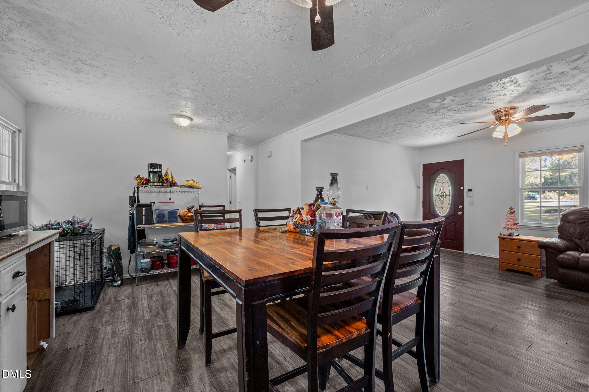 670 Tingen Mine Road Roxboro, NC 27574 - Photo 9 of 30 a view of a dining room with furniture and wooden floor