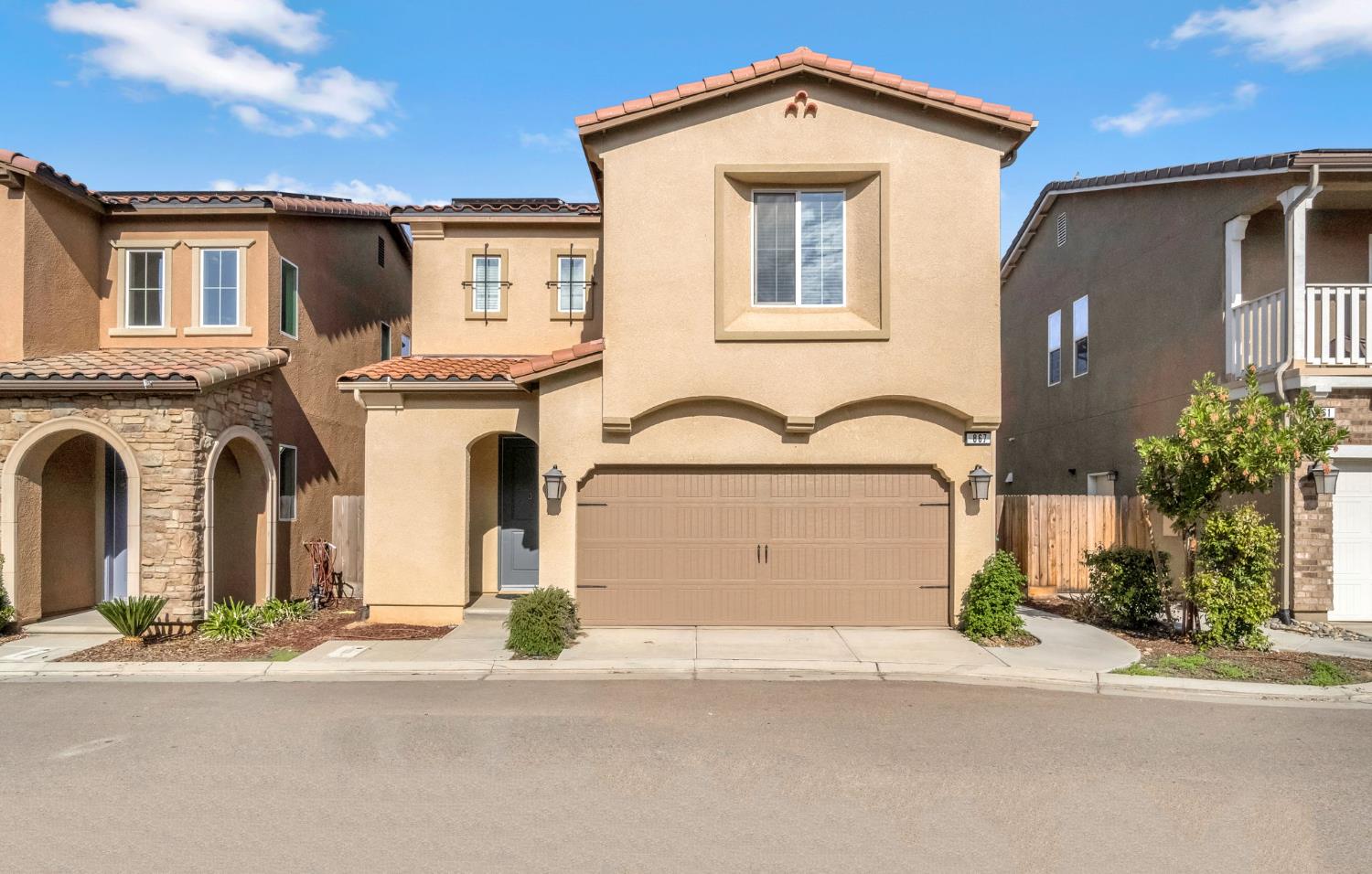front view of a house with a street